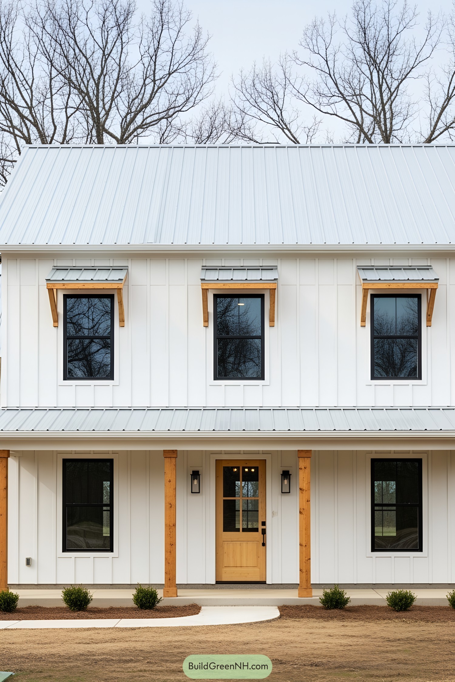 Modern farmhouse with white siding and metal roof