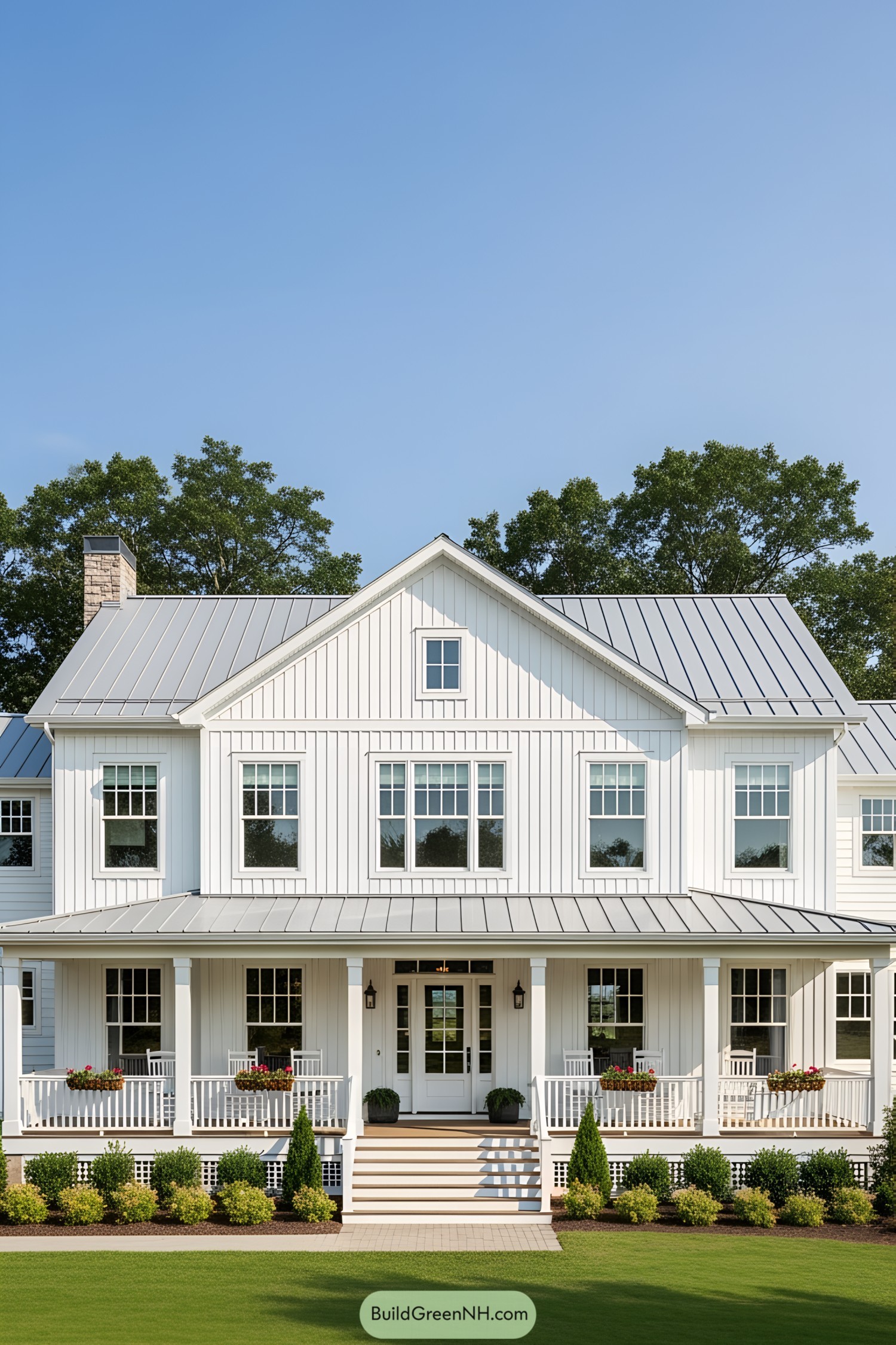 White farmhouse with porch and lush greenery