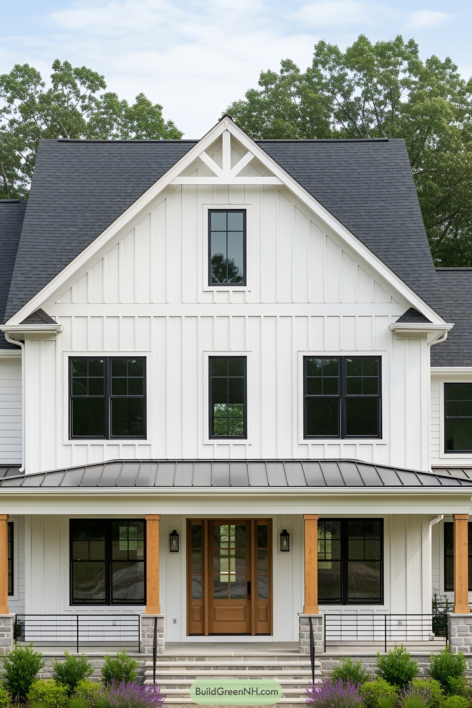 Charming white farmhouse with a steep gray roof
