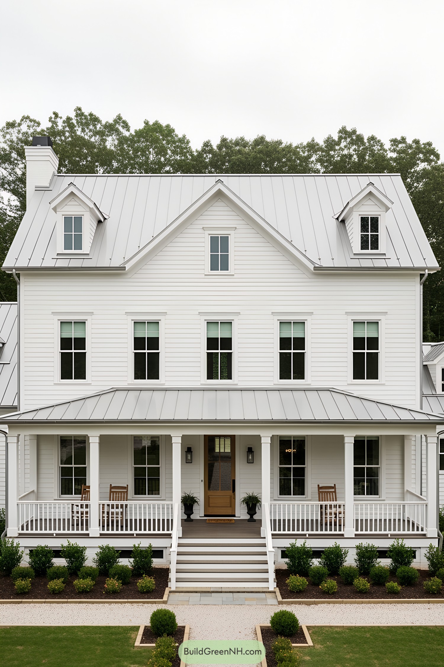 A traditional farmhouse with a large front porch and gabled roof