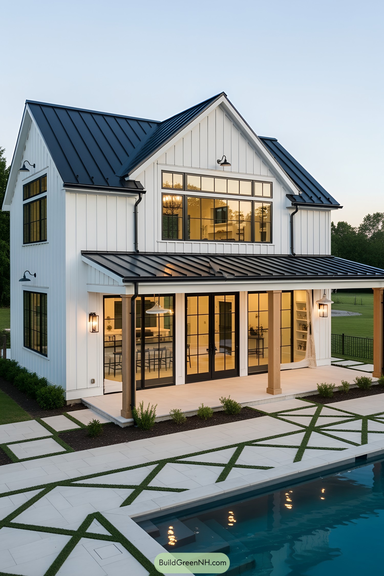 Modern farmhouse pool house with a sleek black roof and large windows