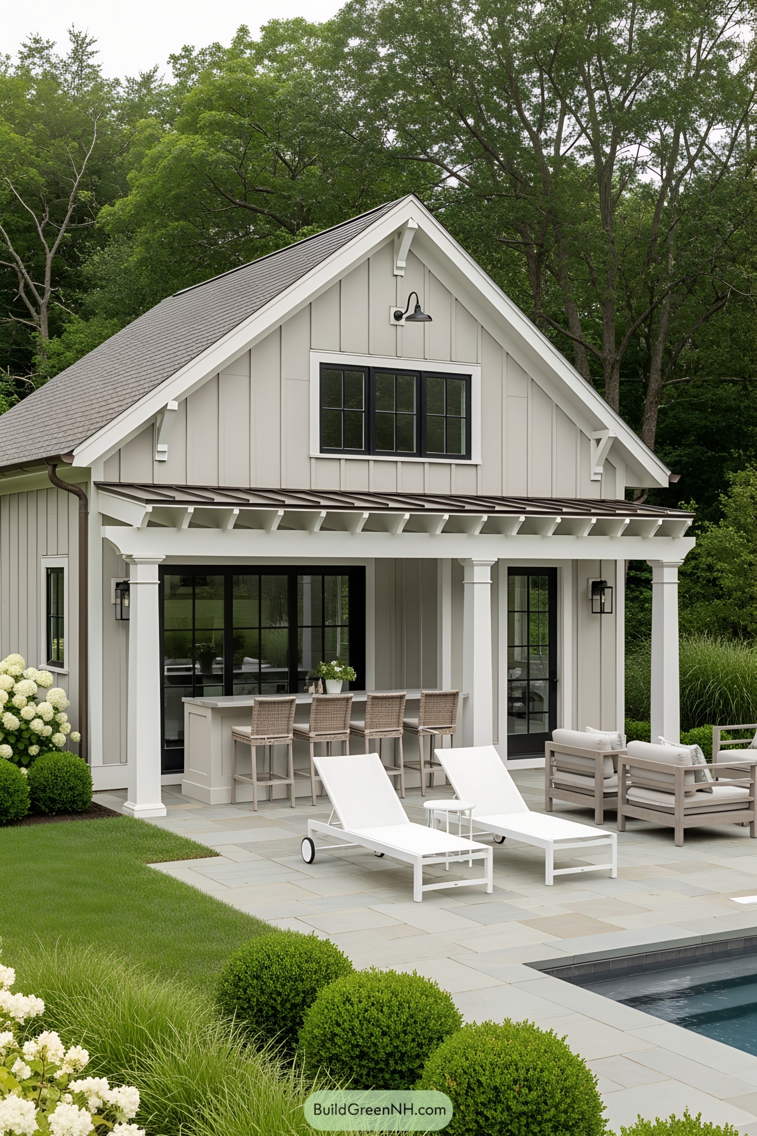Quaint farmhouse pool house with seating area