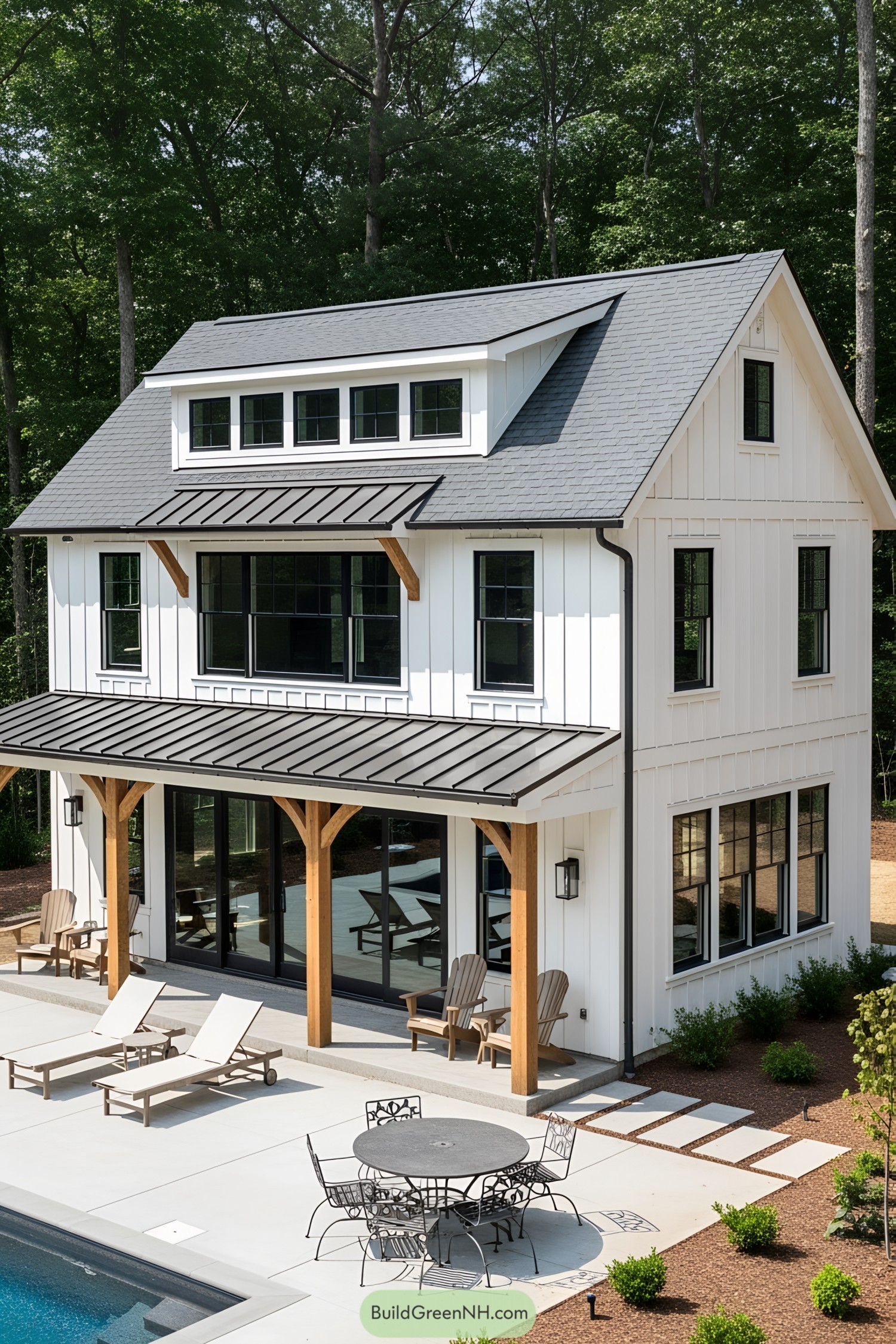 White farmhouse-style pool house with wooden accents