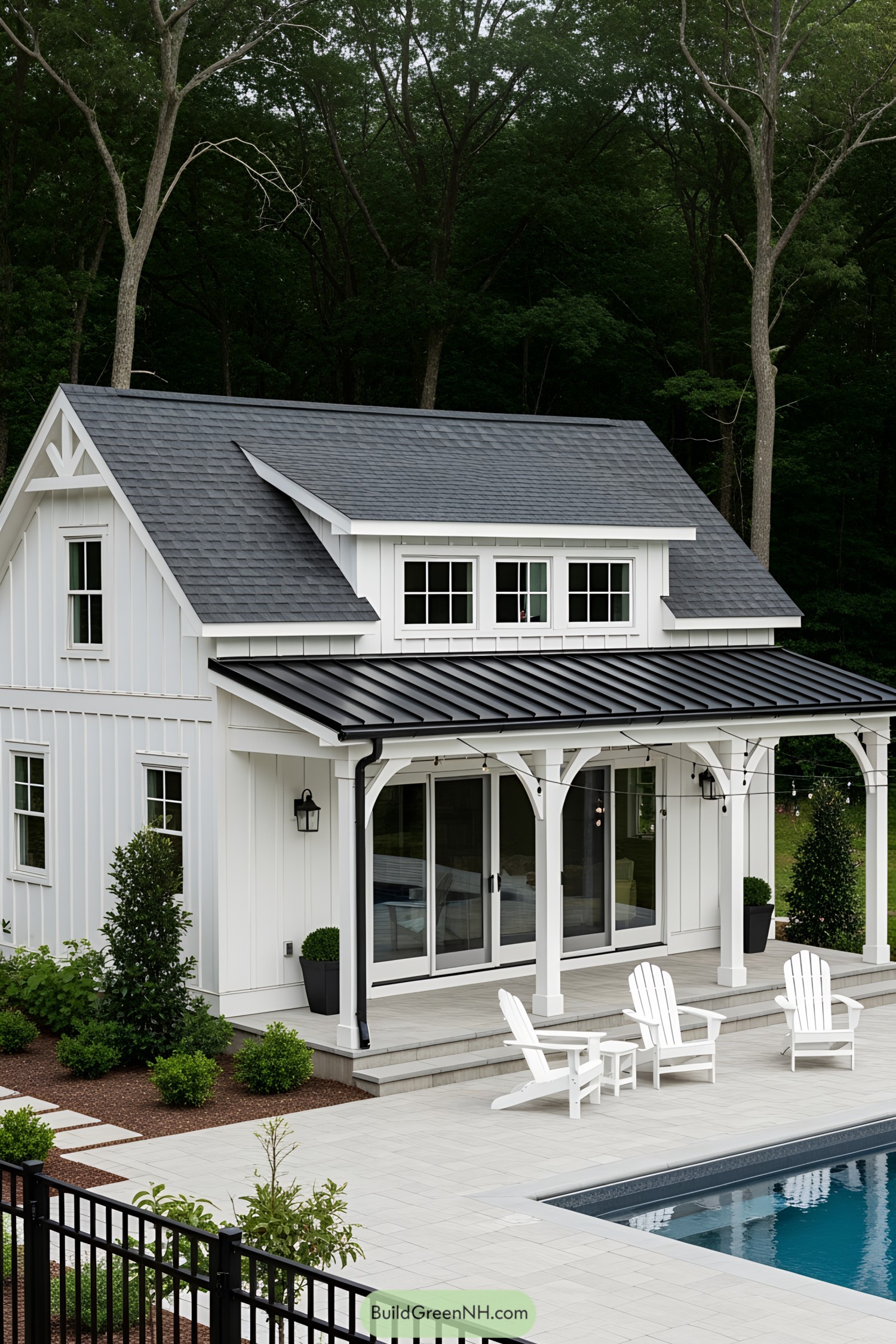 Elegant white farmhouse with a porch by the pool