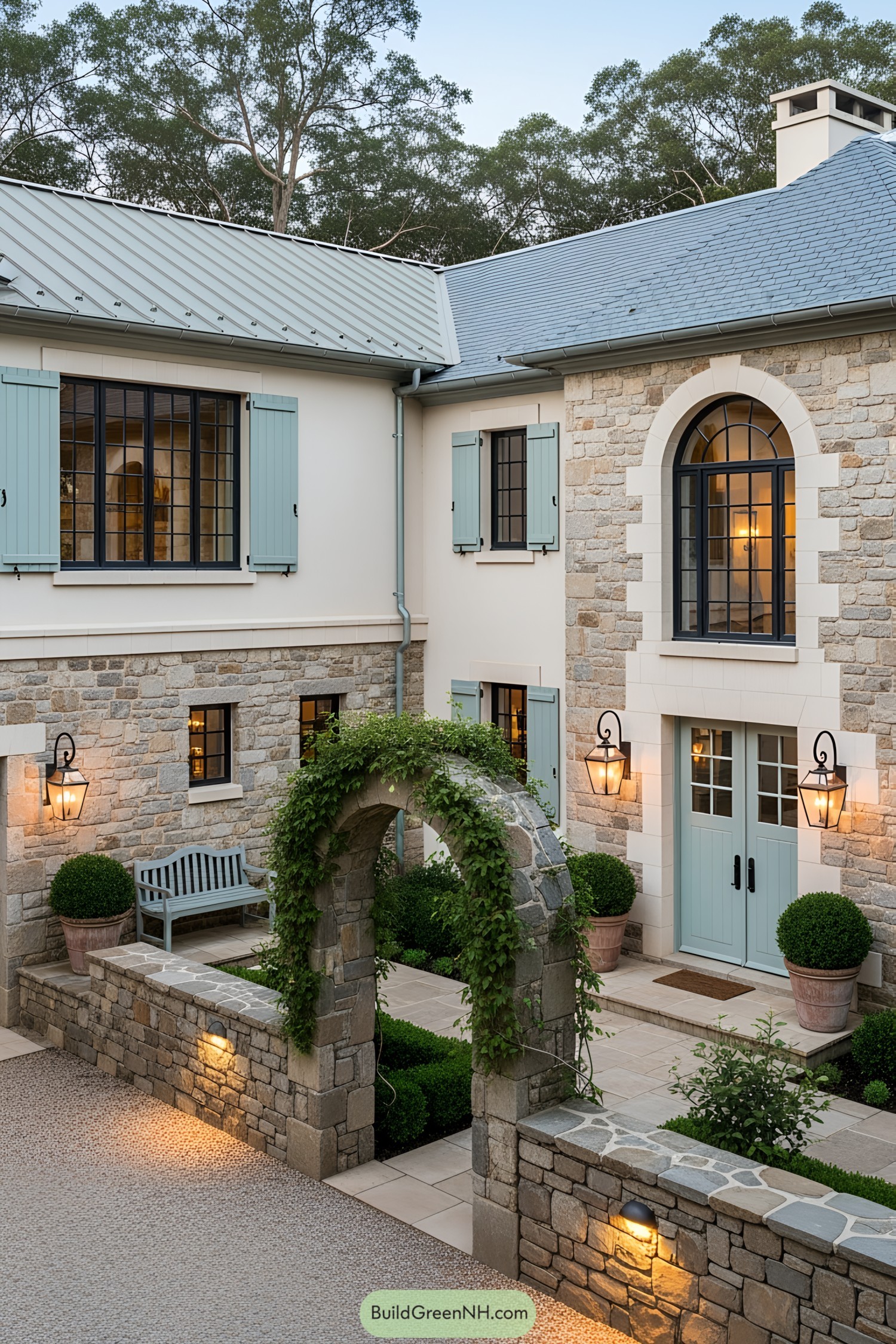 Stone cottage with a quaint courtyard and blue shutters