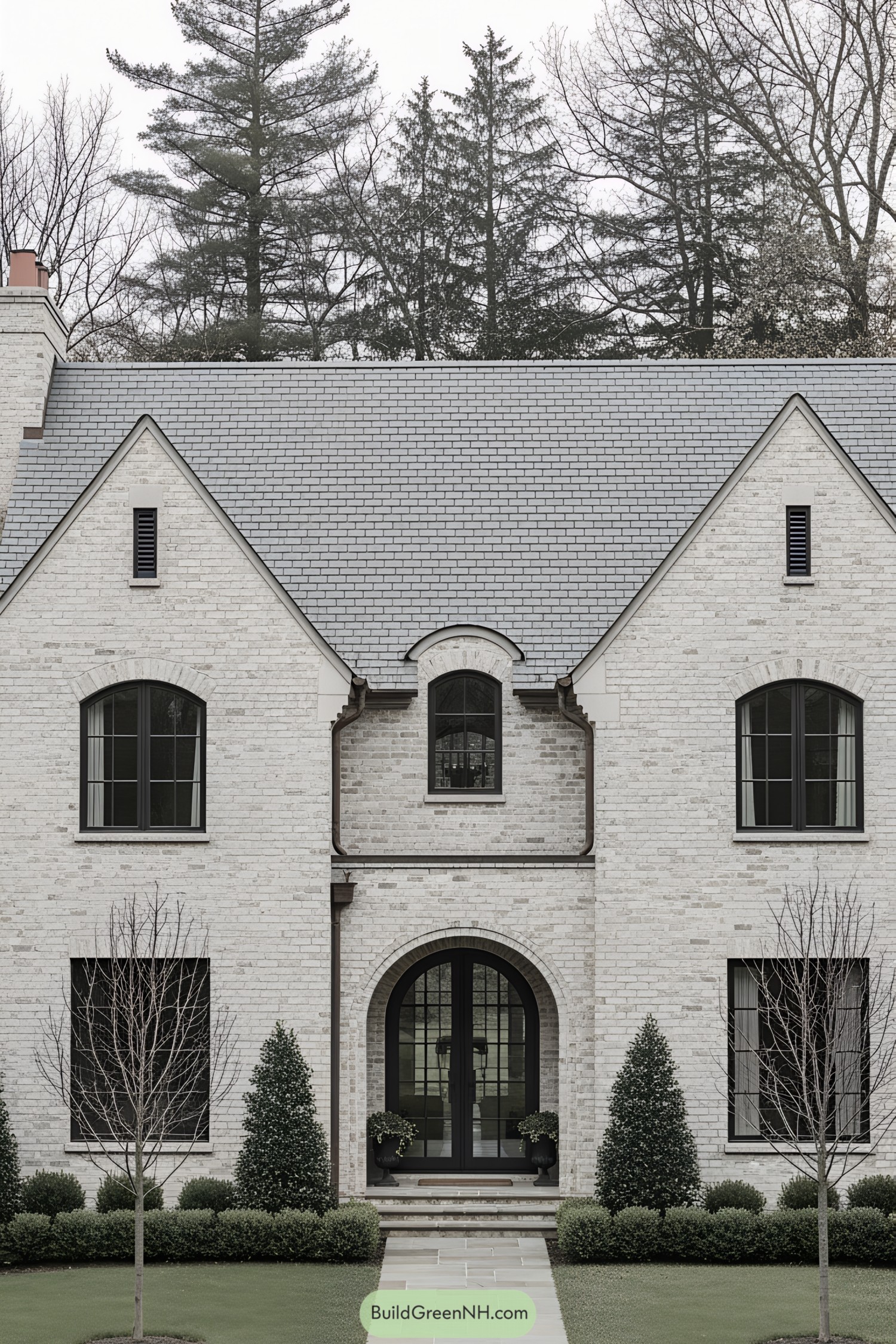 Charming French cottage with stone facade and arched windows
