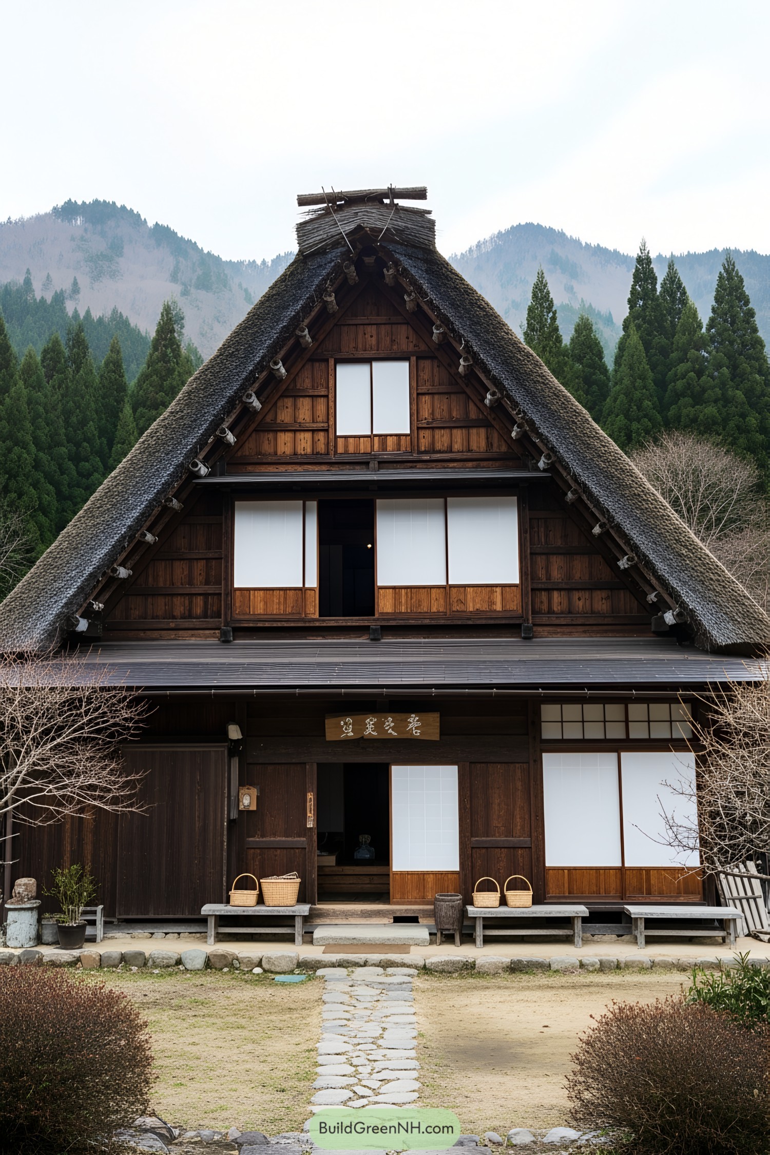 A-frame farmhouse with thatched roof surrounded by nature