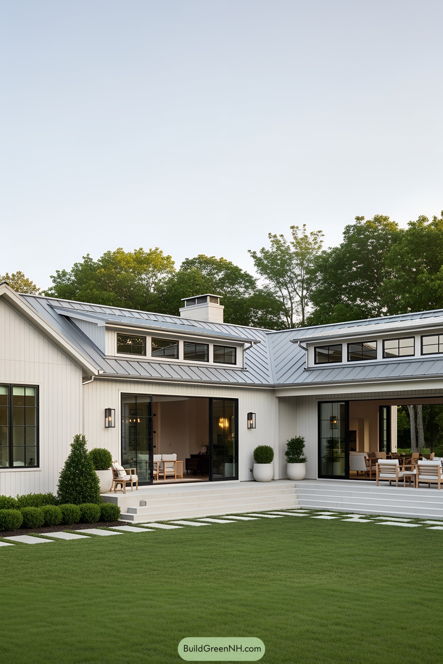 Modern L-shaped ranch house with manicured lawn