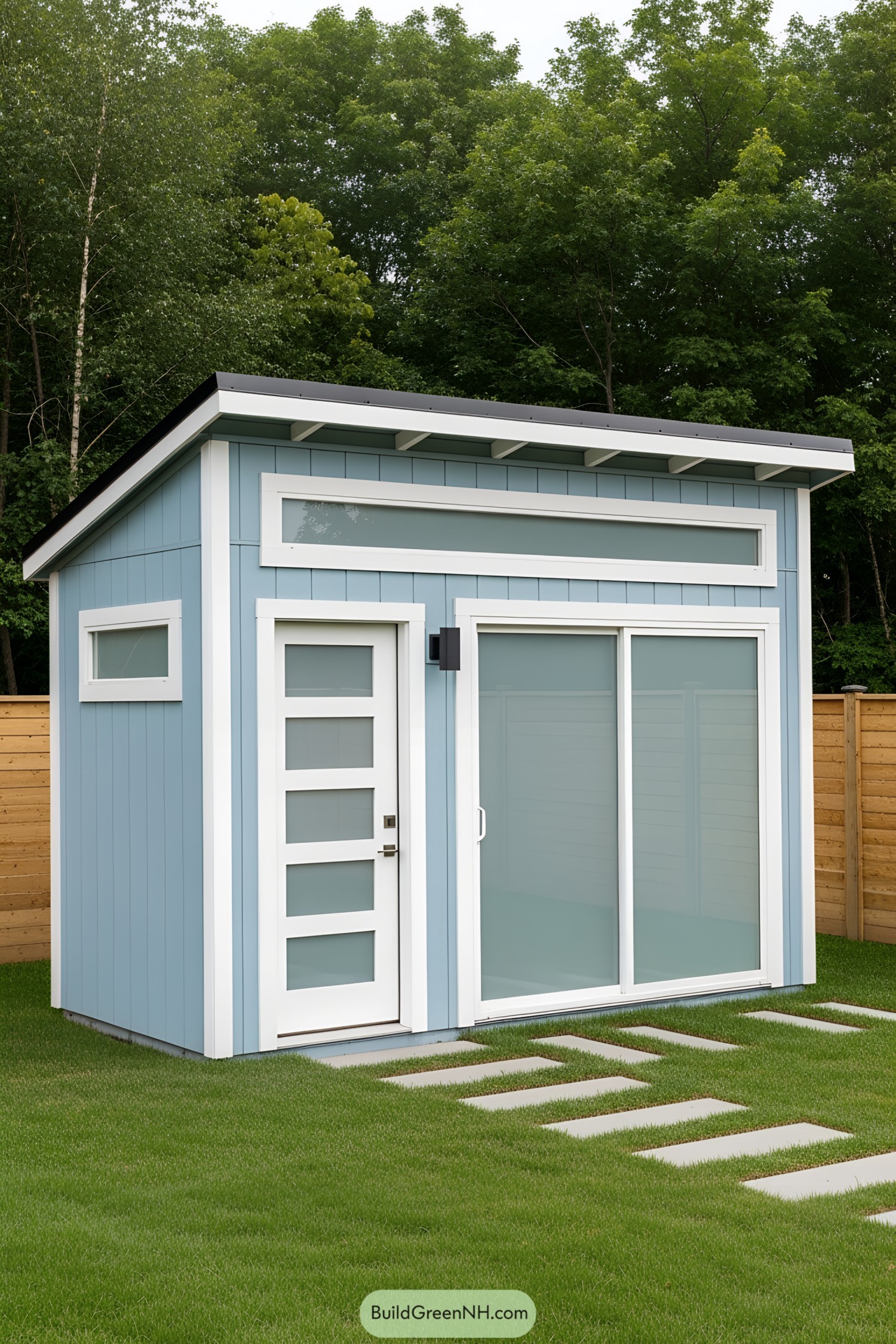 Small blue shed with modern design, set in a green yard