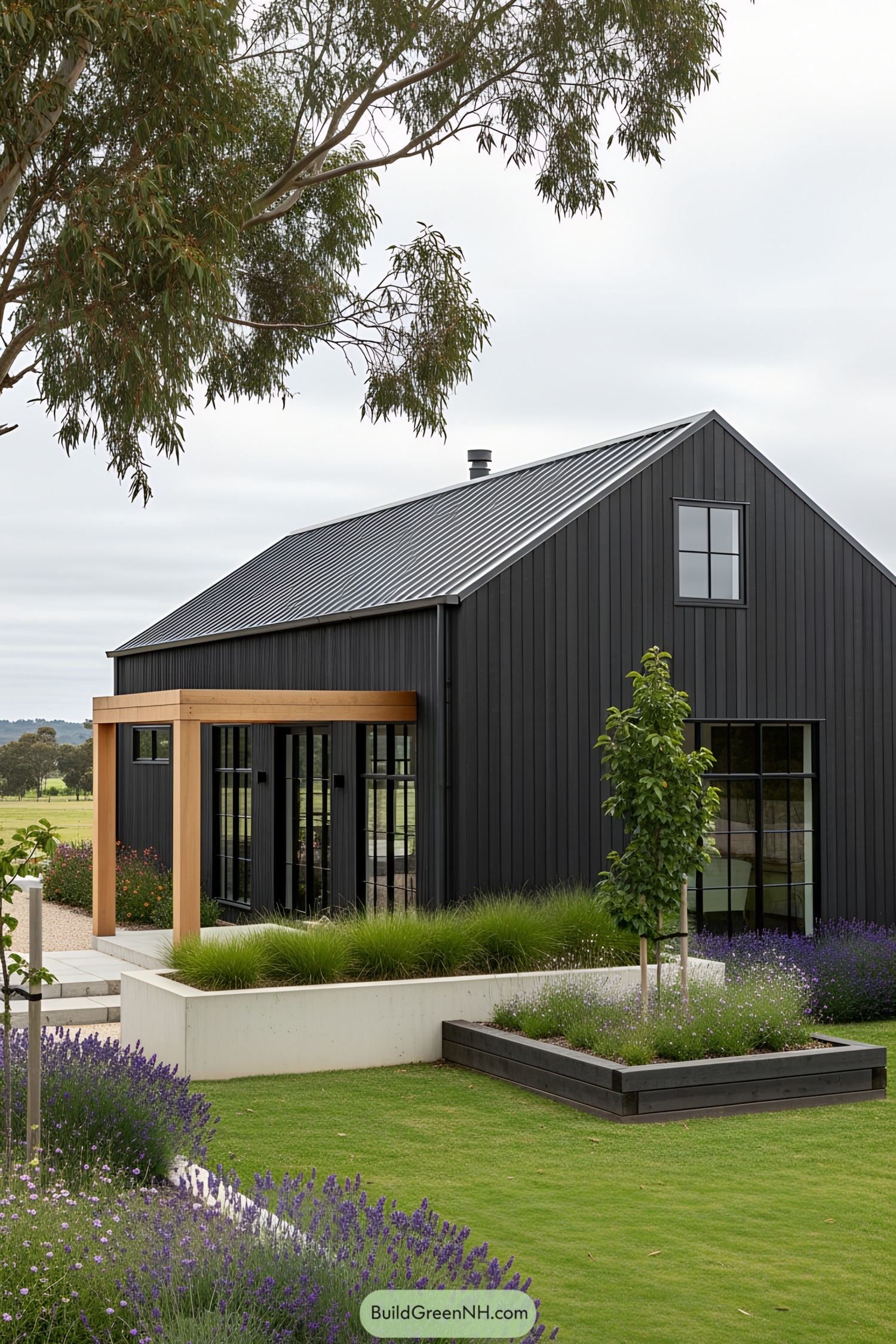Modern farmhouse with black exterior and lush greenery