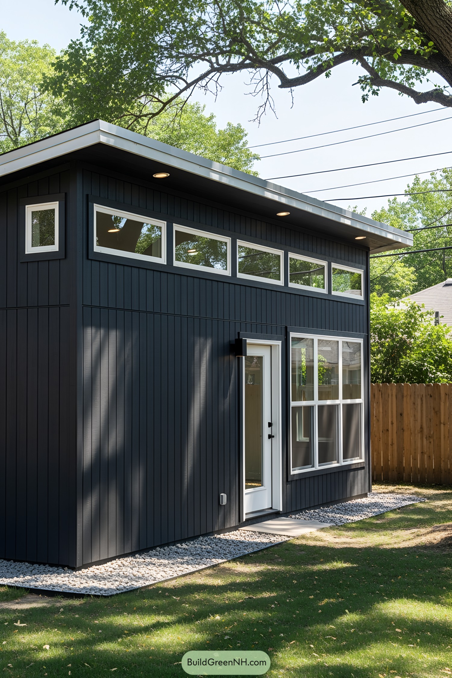 Modern shed with sleek black exterior and glass door