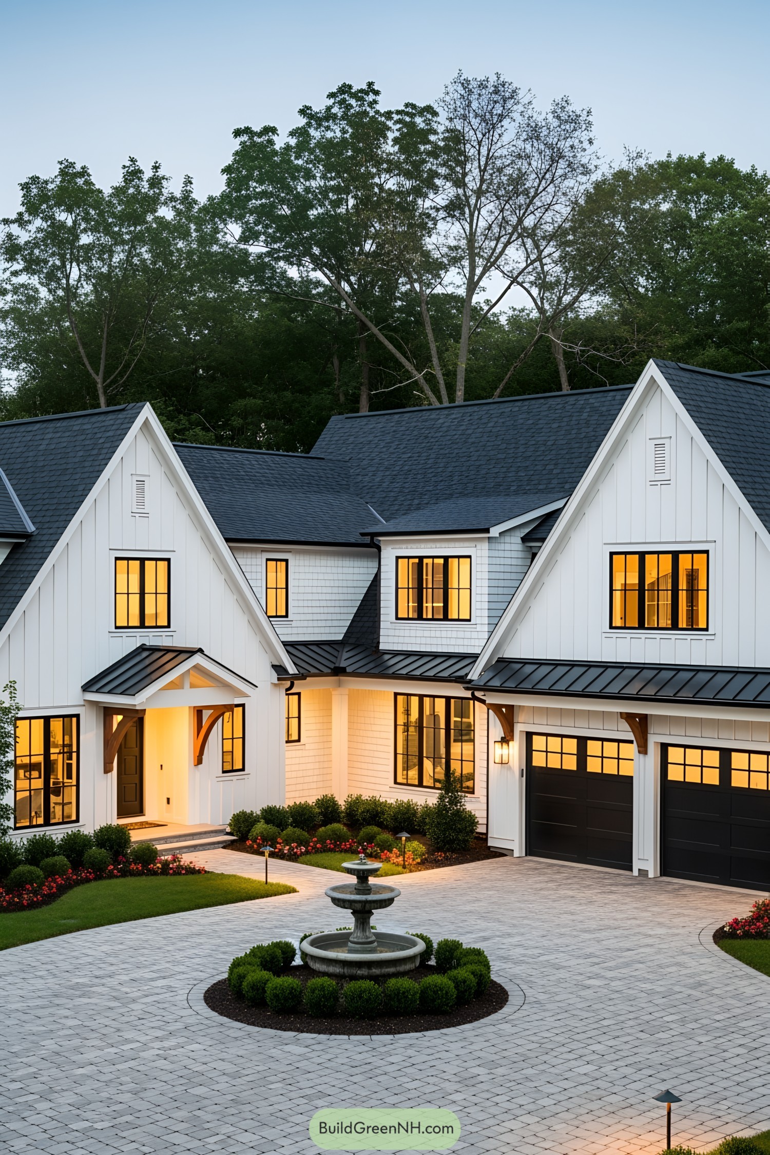 Large white house with multiple peaked roofs and a paved driveway