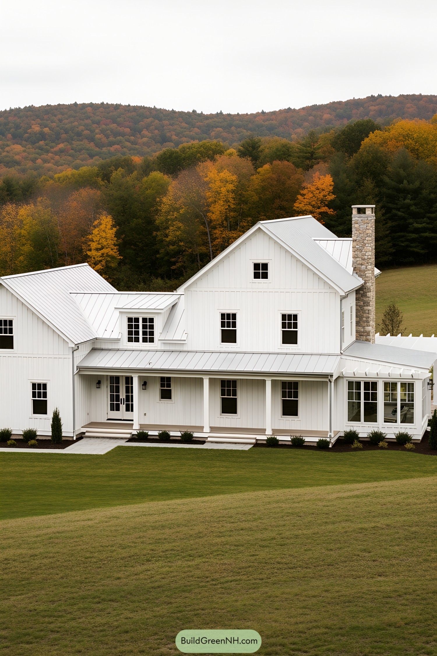 Idyllic white farmhouse with a mountain backdrop