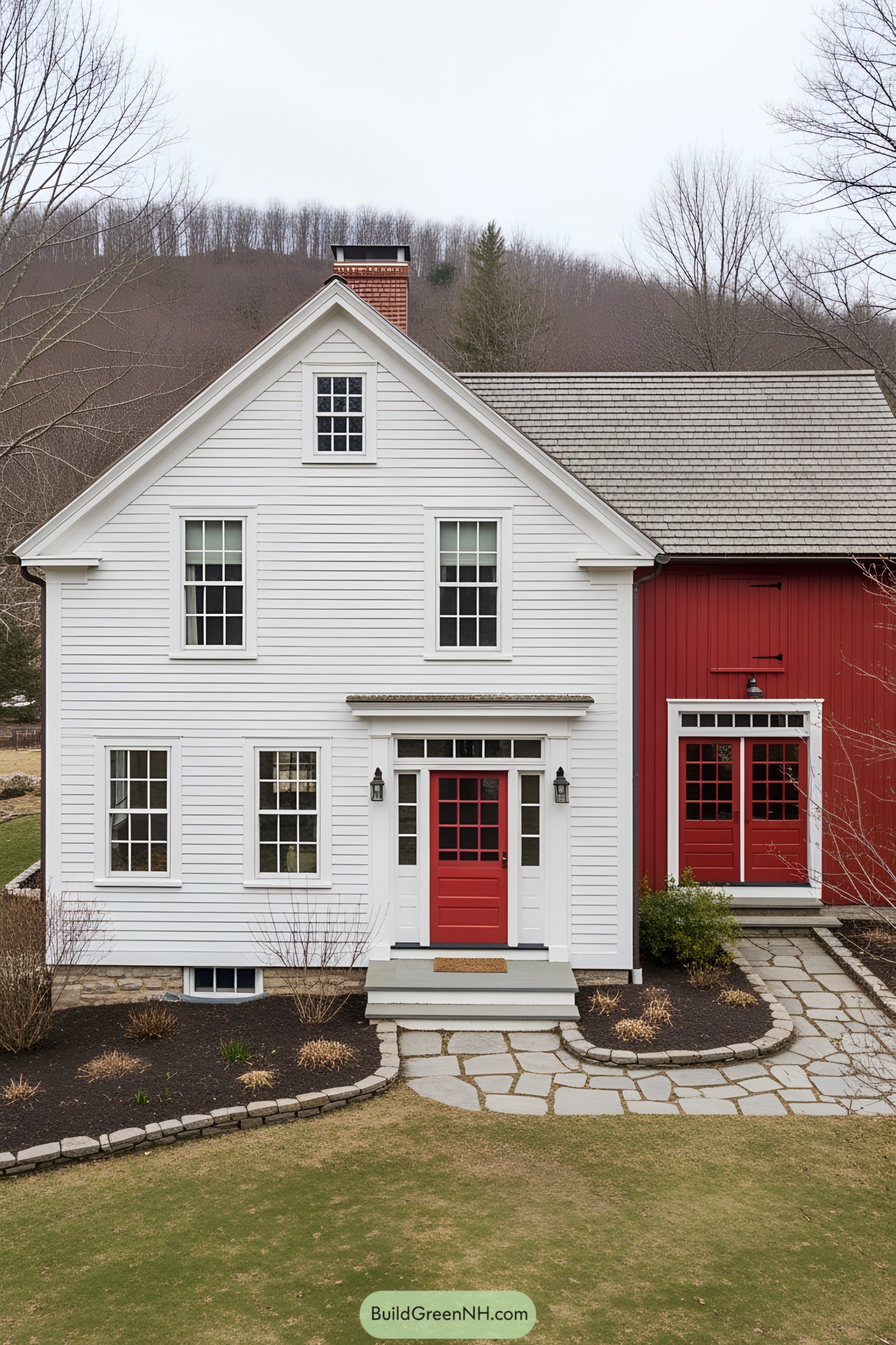 White and red farmhouse with a bold red door