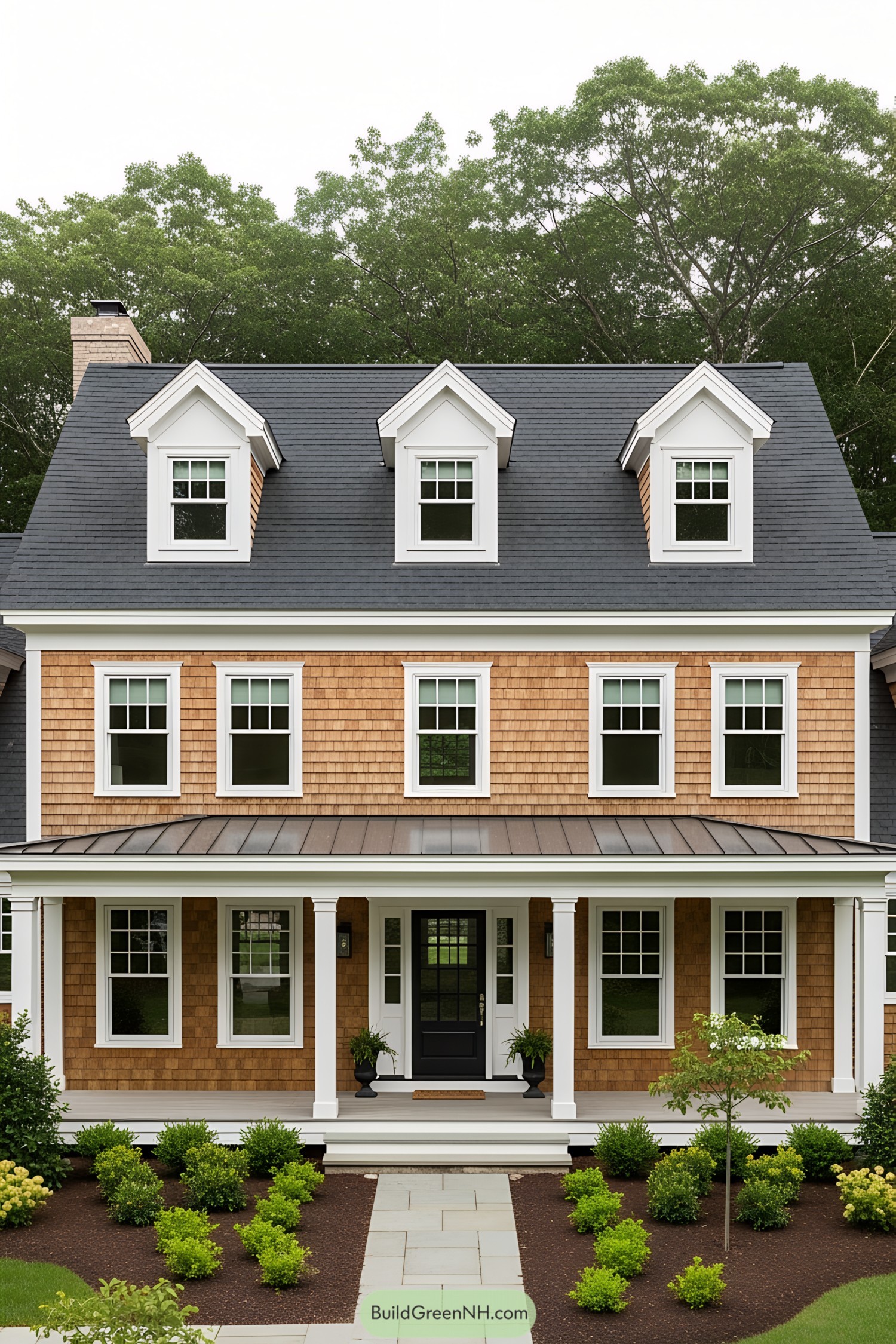Classic New England farmhouse with dormer windows