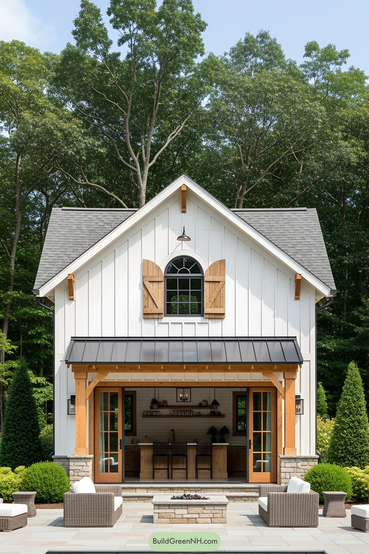 Small cozy pool house with open doors to a patio, surrounded by lush greenery