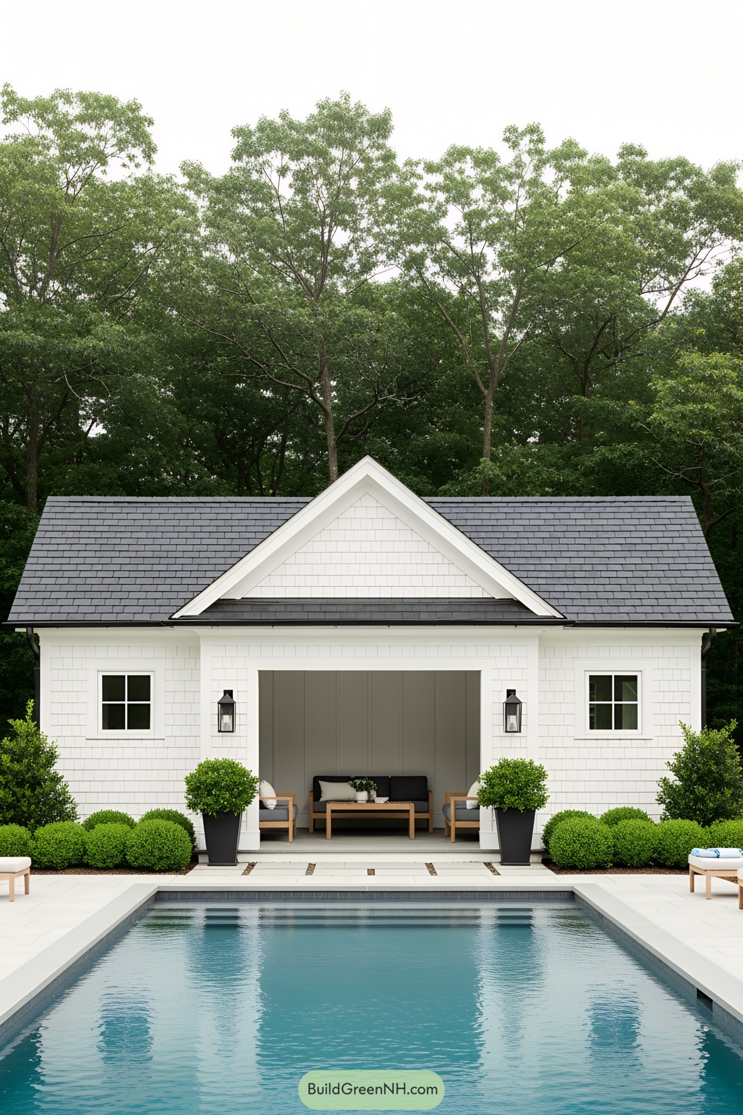 White cabana beside a pool with lush greenery around