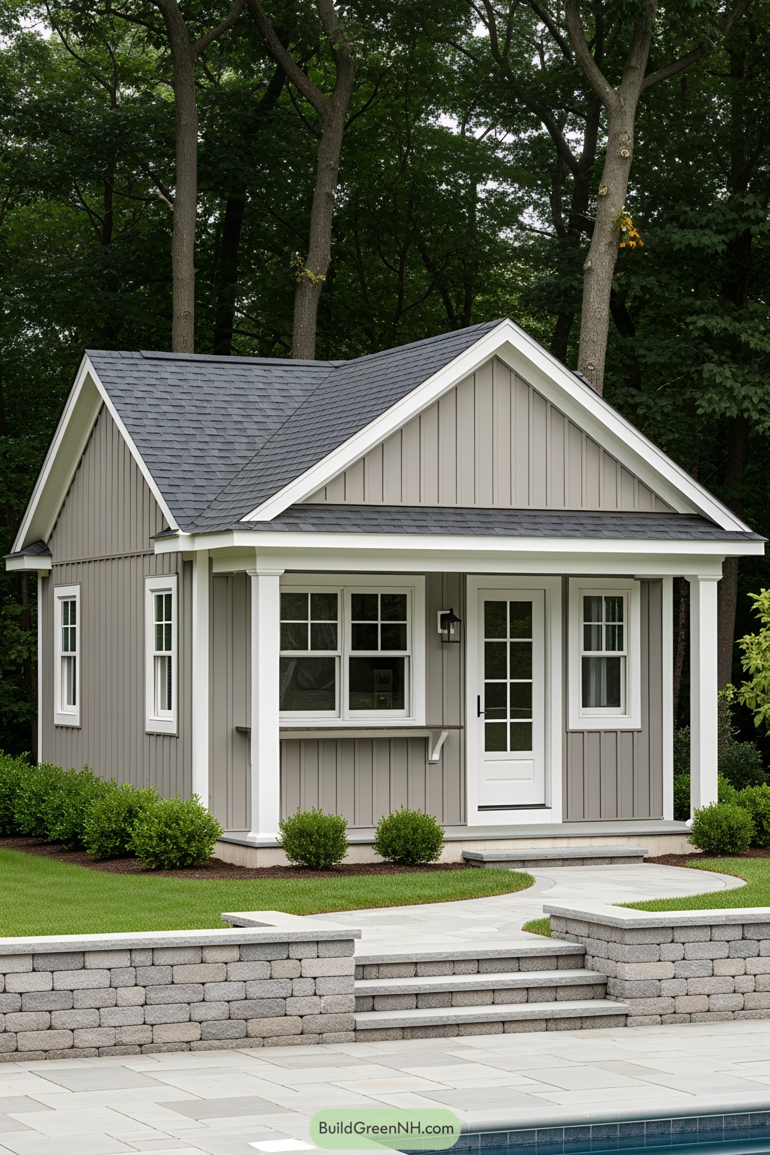 Tiny gray pool house with a charming porch