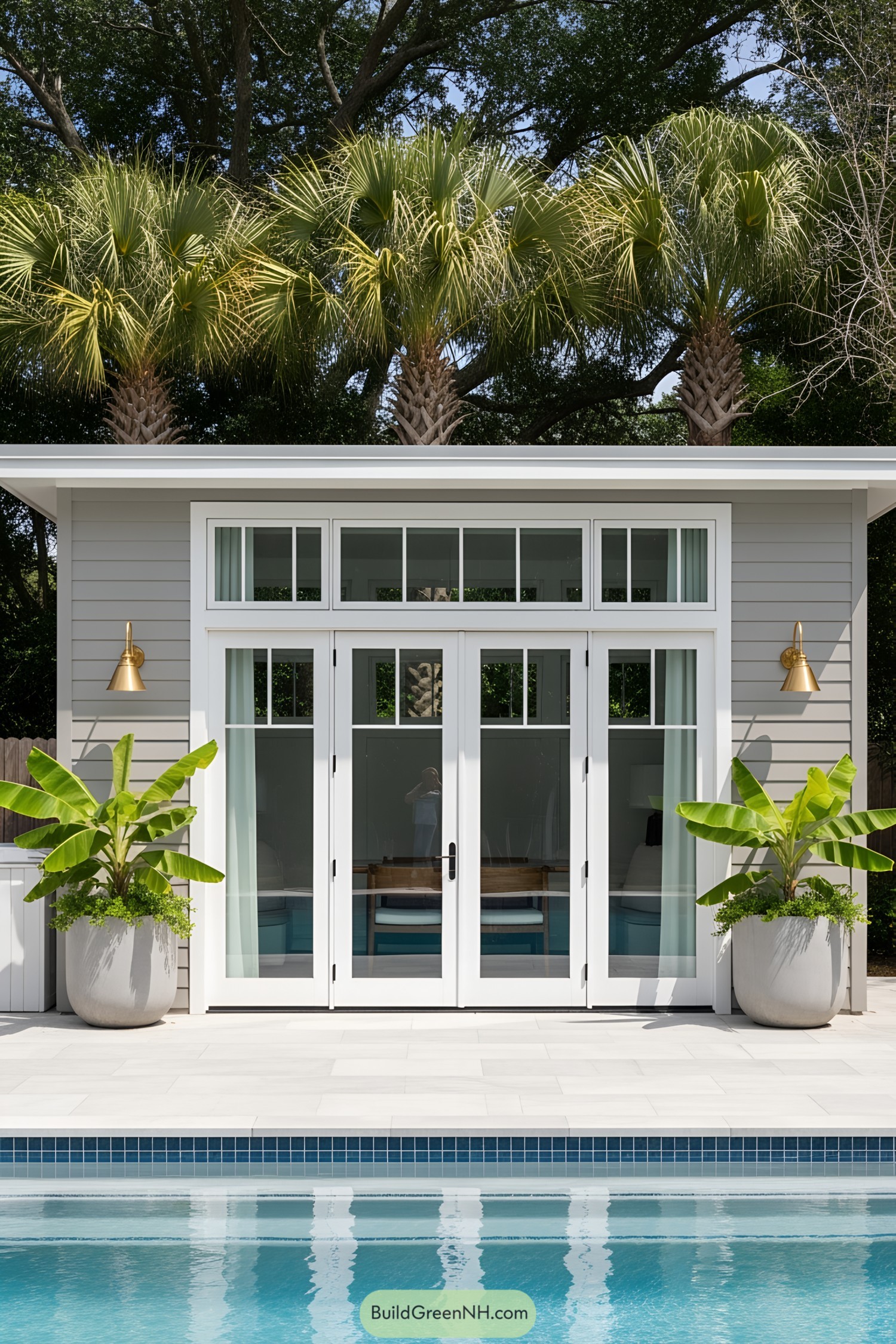 Modern poolside guest suite with glass doors