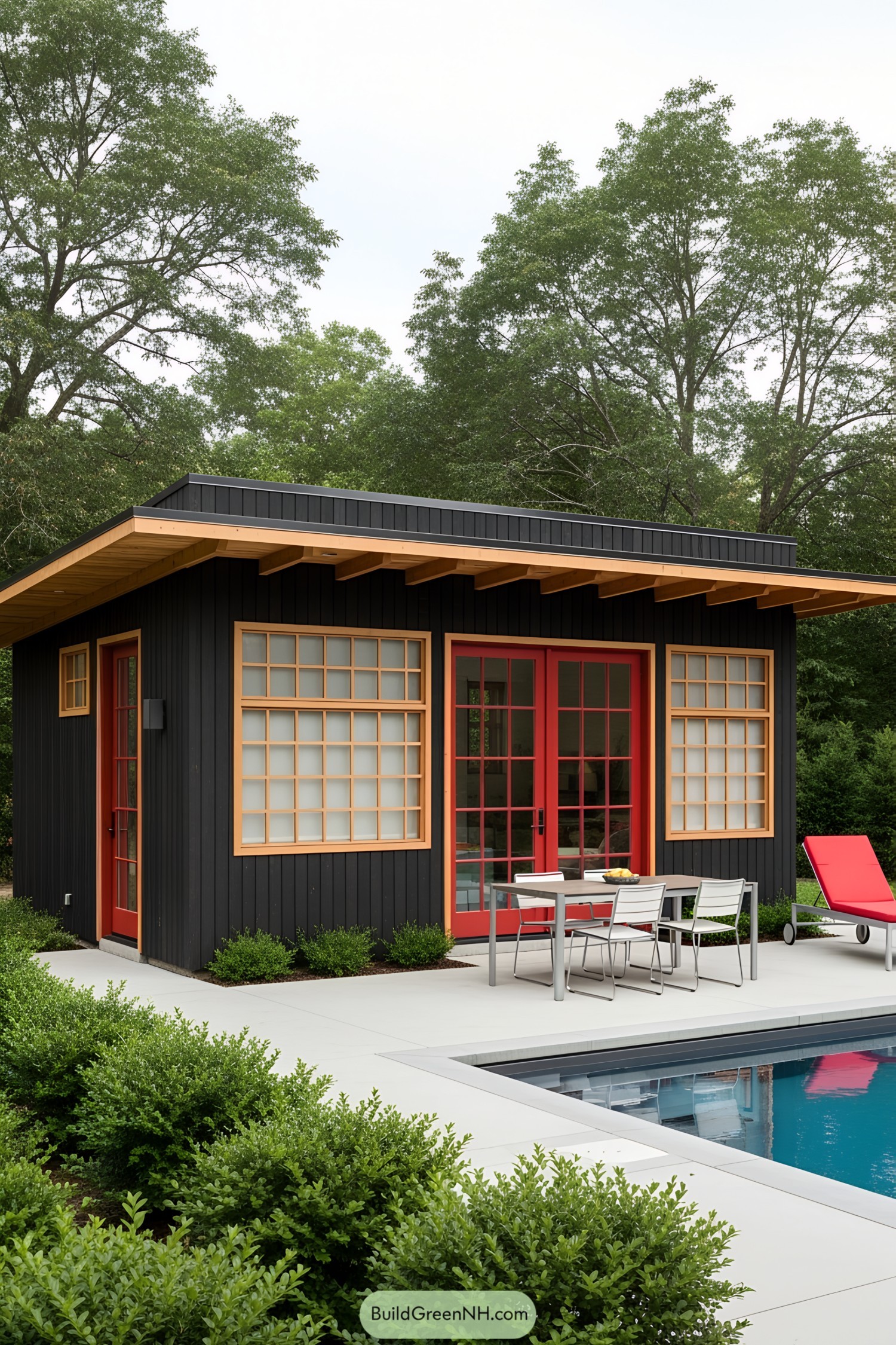 Modern poolside guest house with red accents