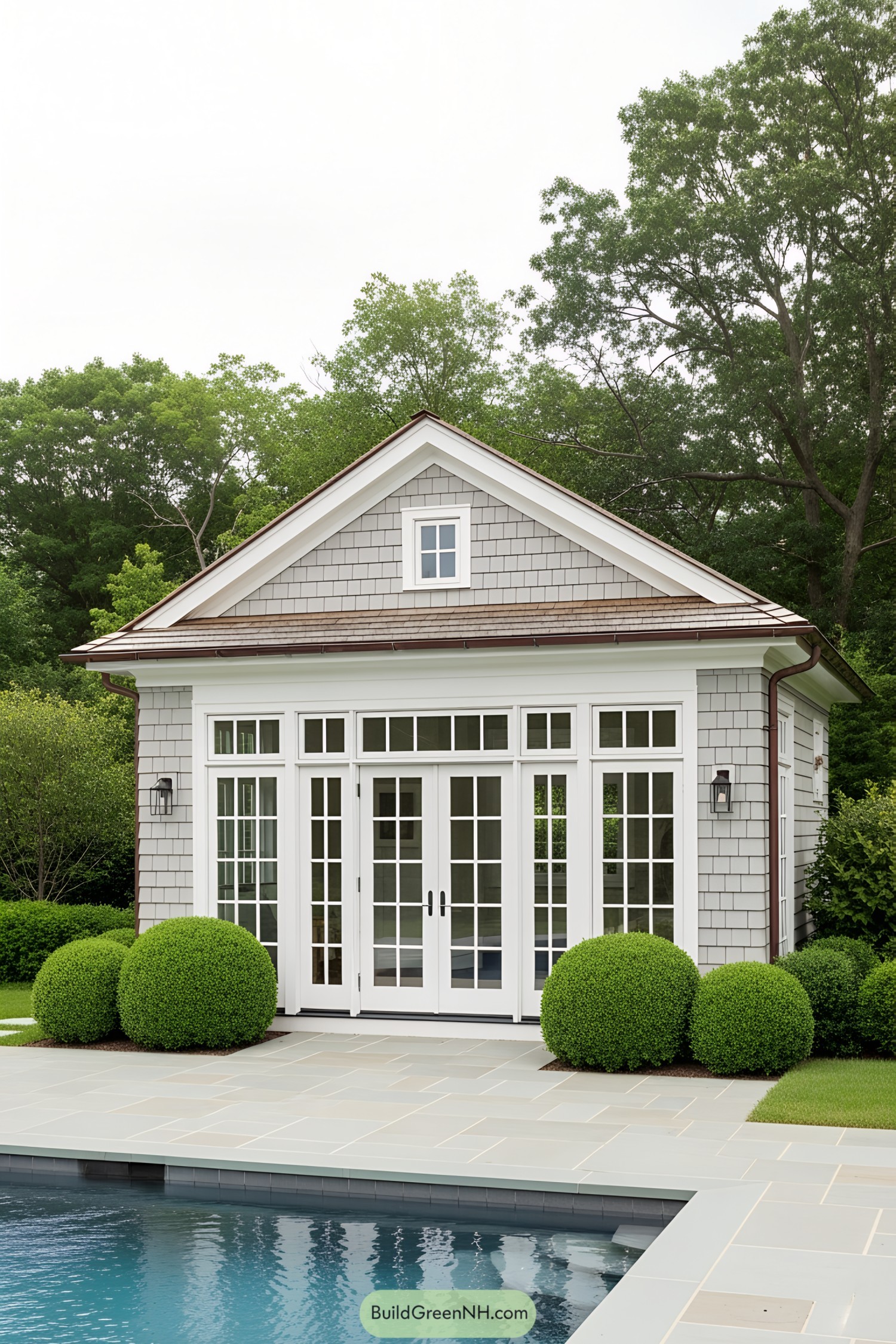 A quaint poolside guest suite with large windows