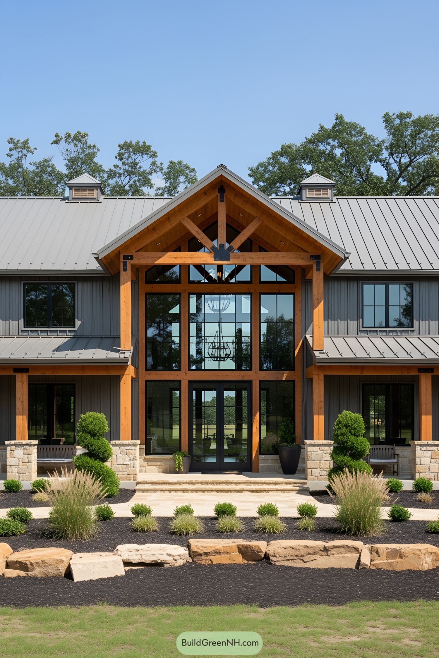 Modern barndominium with wooden accents and metal roofing