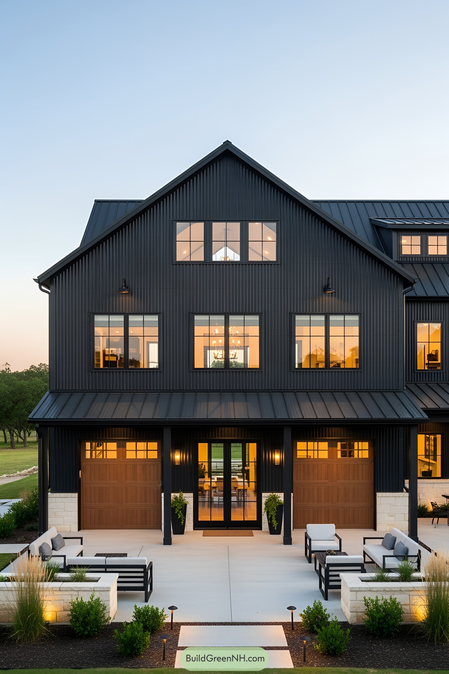 Stylish black barndominium at sunset
