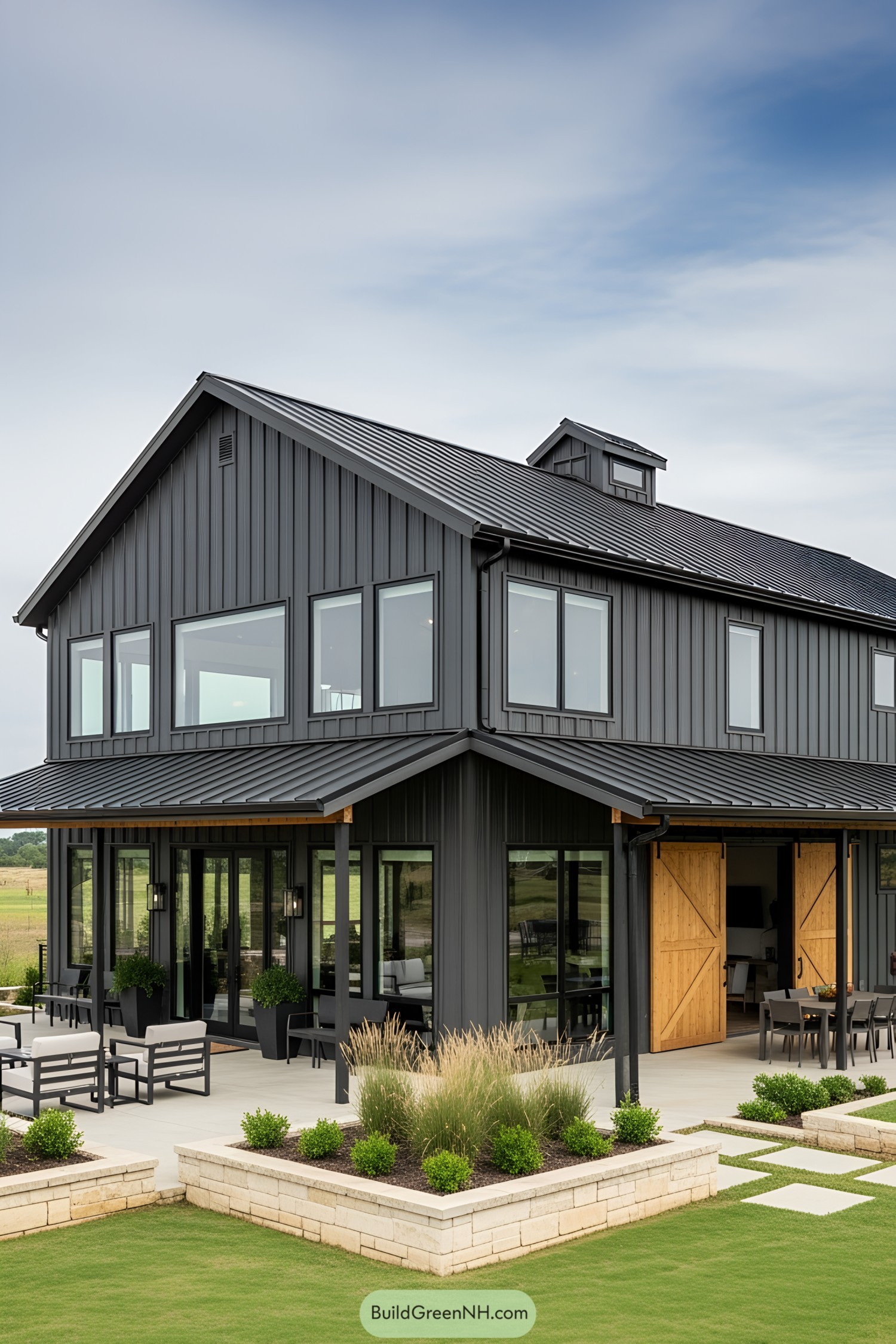 Sleek barndominium with a stylish exterior and lush surroundings