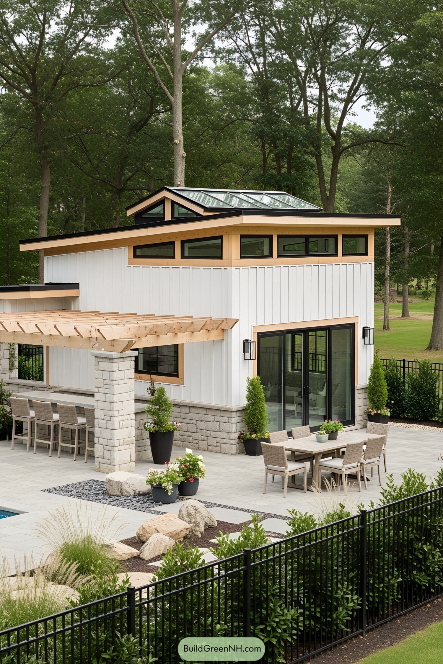 Stylish pool house with large windows and outdoor seating