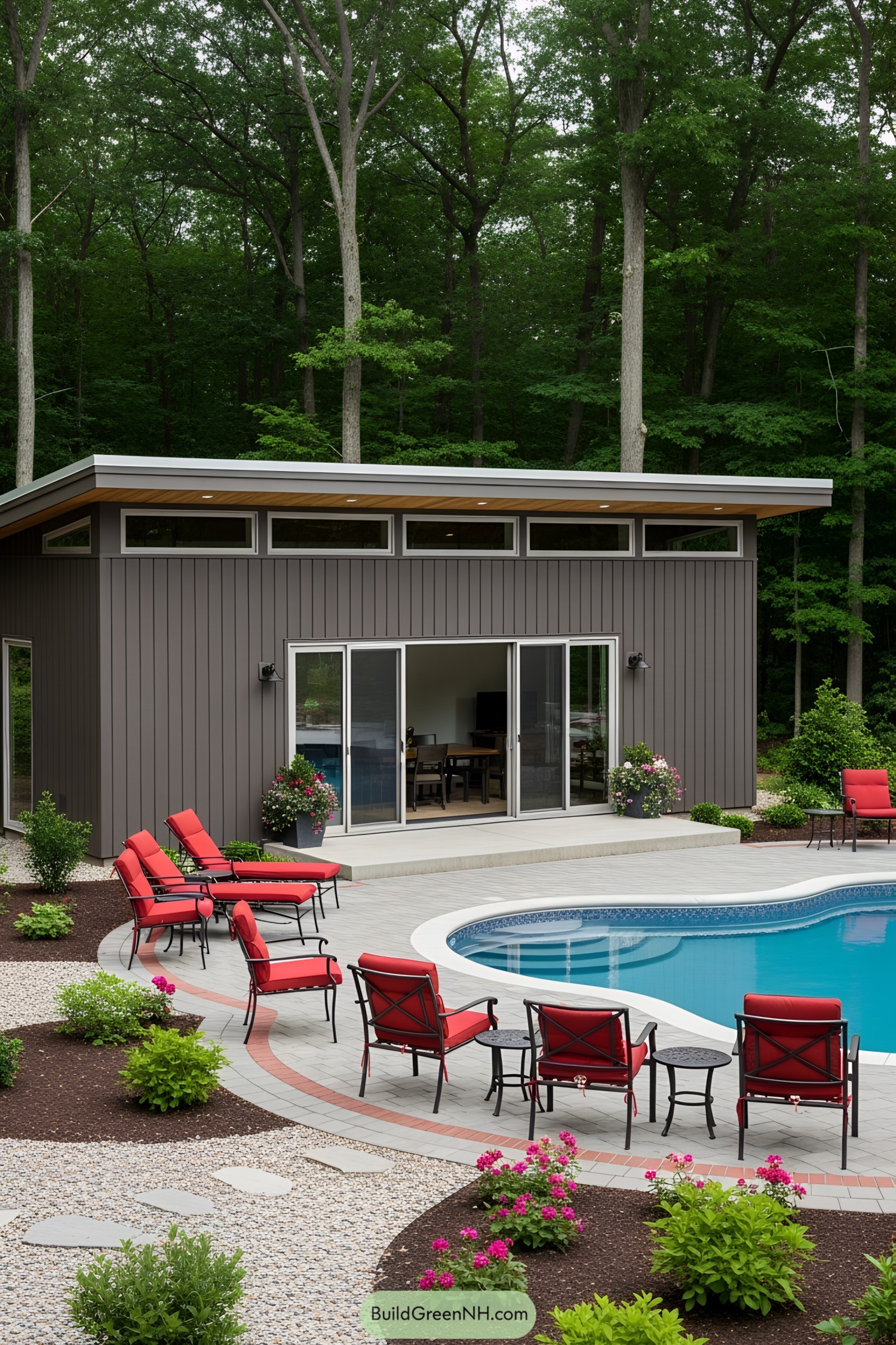Modern pool house with lush green surroundings