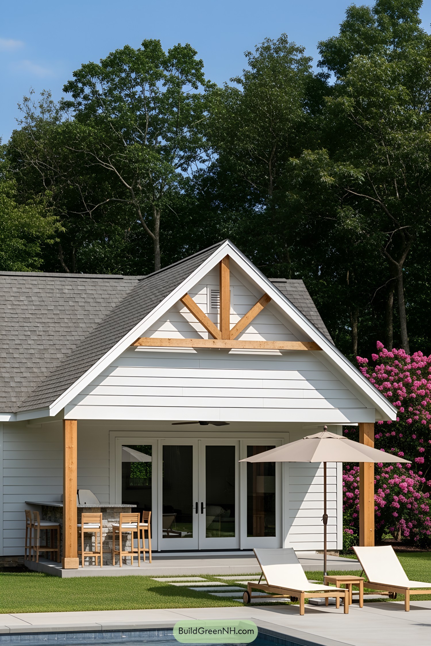 Cozy pool house surrounded by greenery
