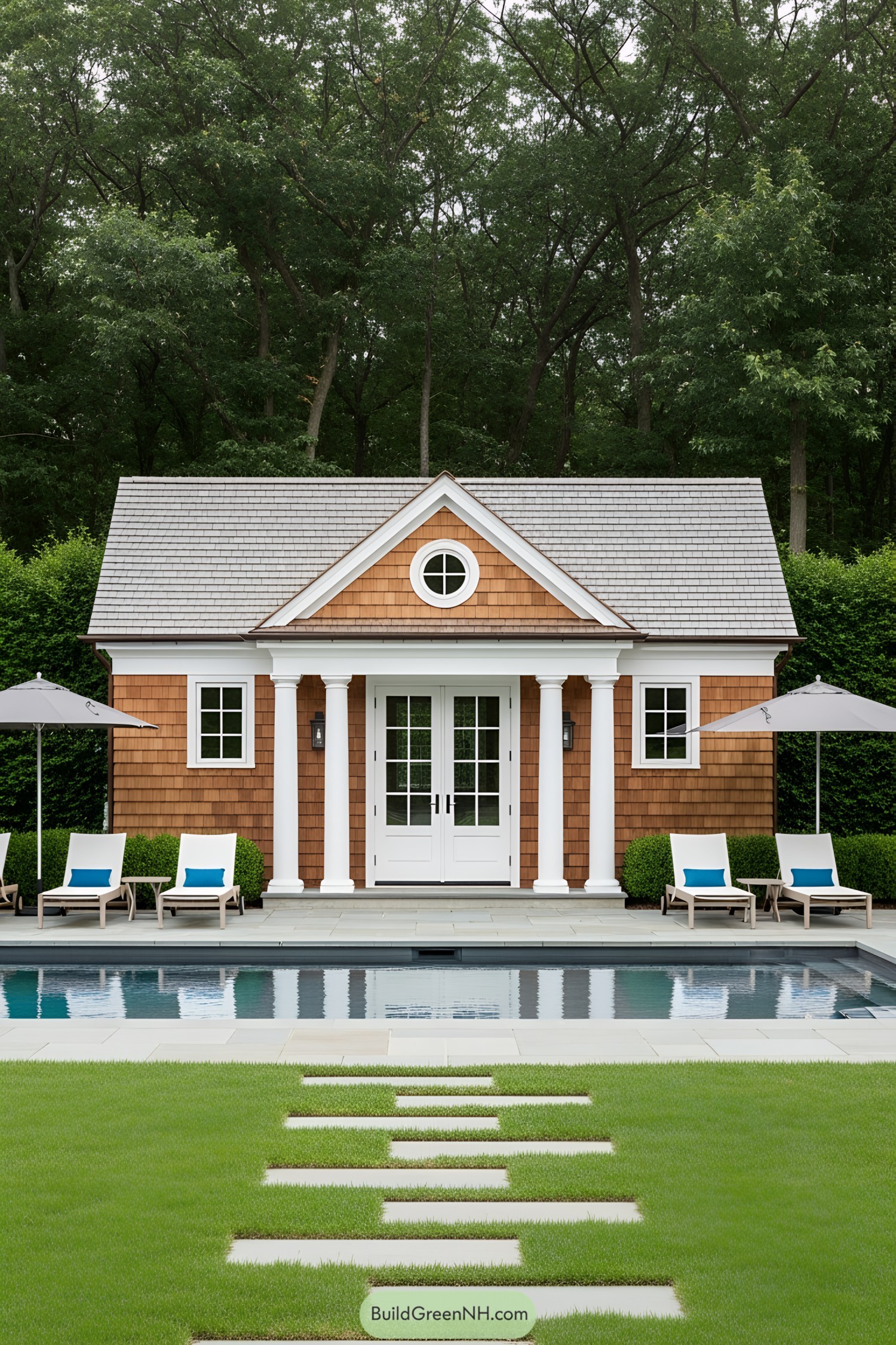 Charming pool house with classic design next to a pristine pool