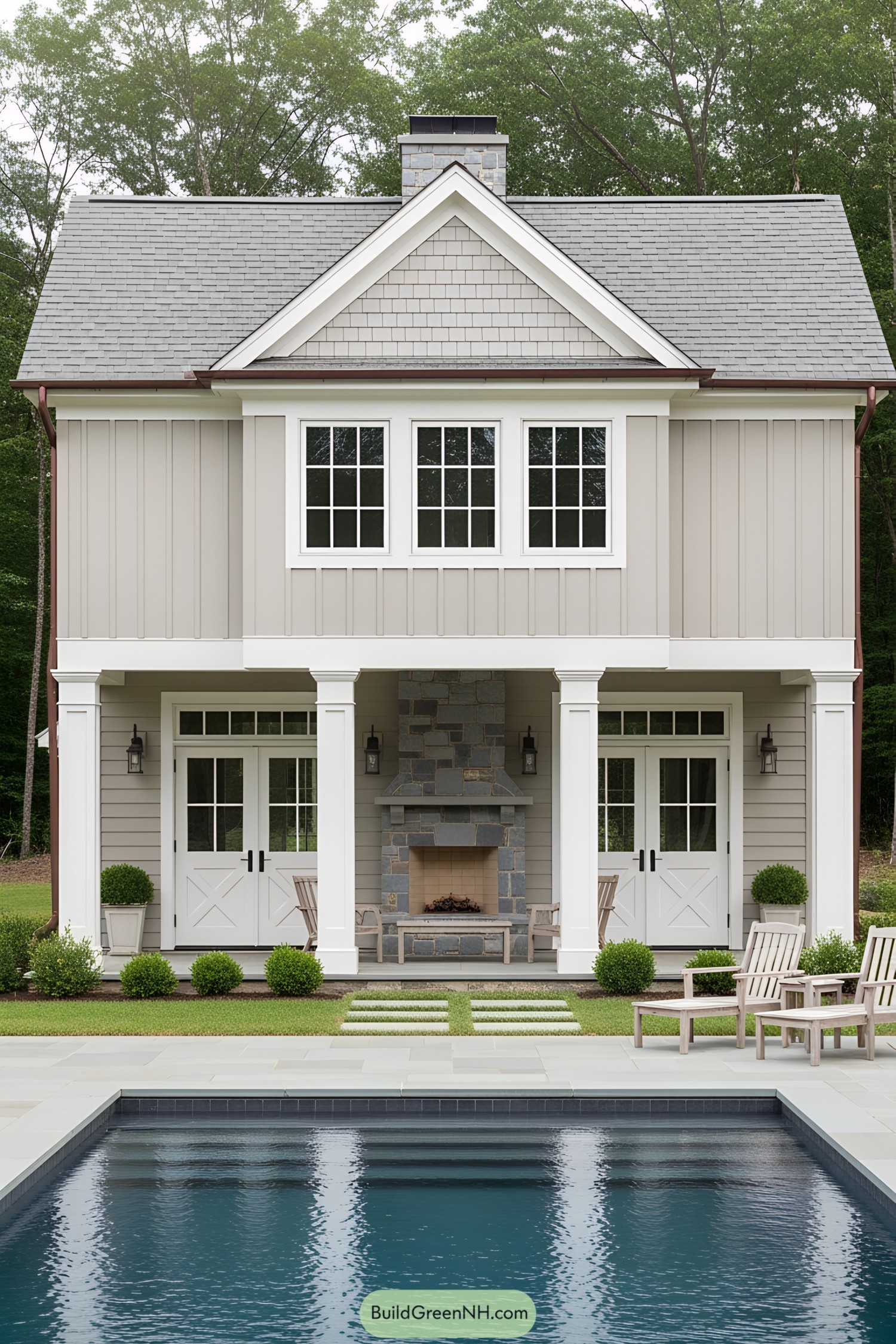 Charming two-story pool house with a gabled roof