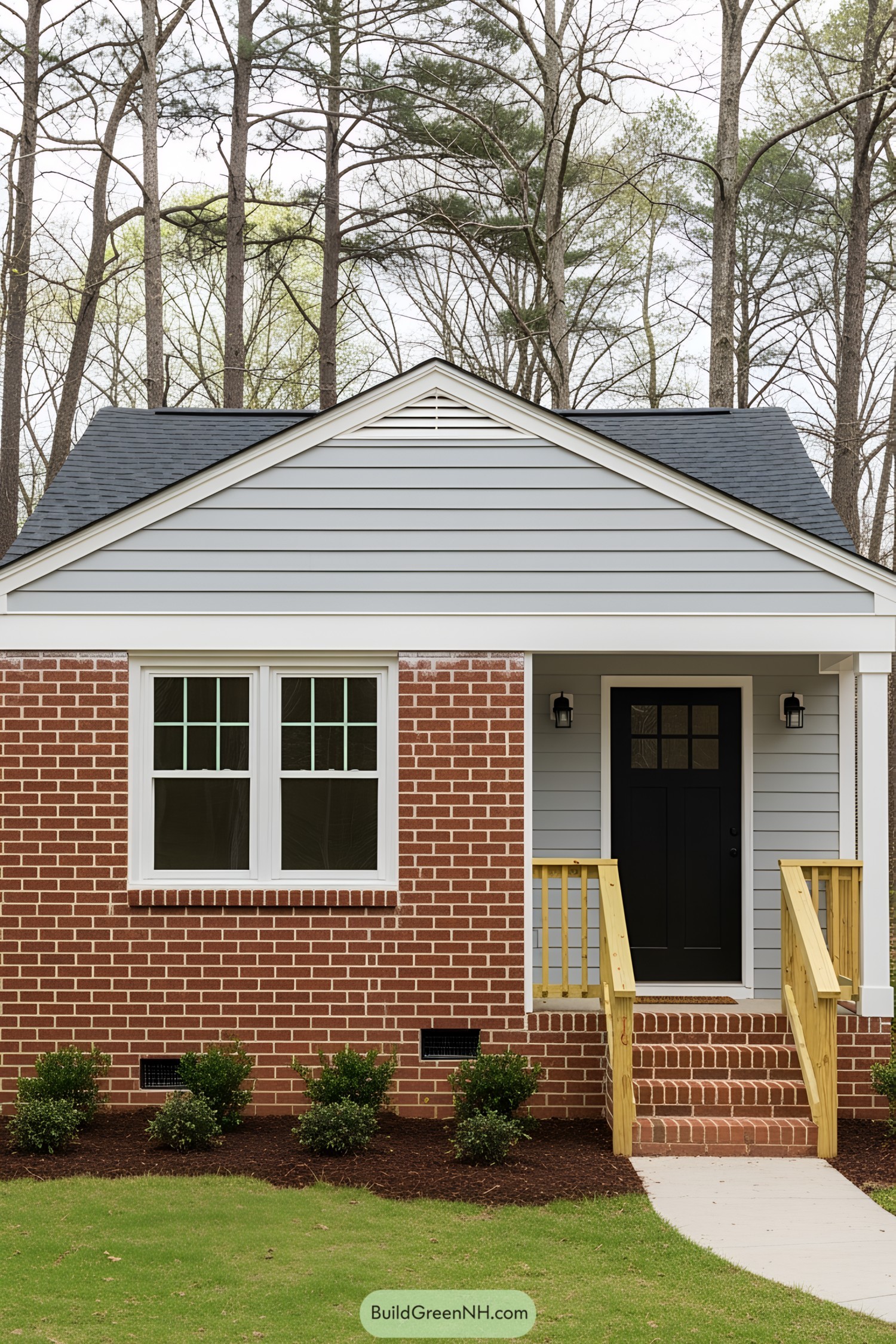 Compact cottage with brick and wood siding