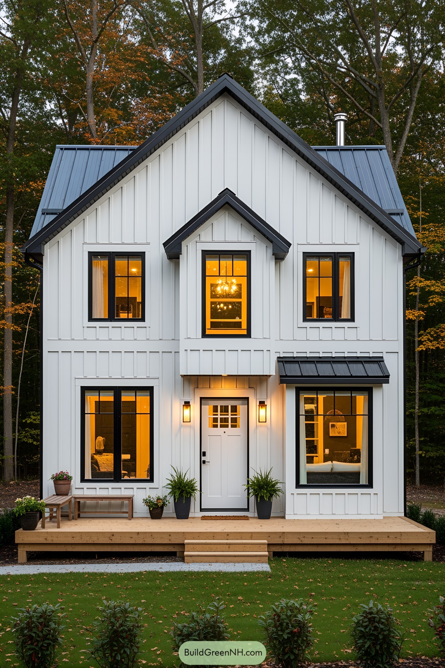 Cozy white cottage with a wooden deck