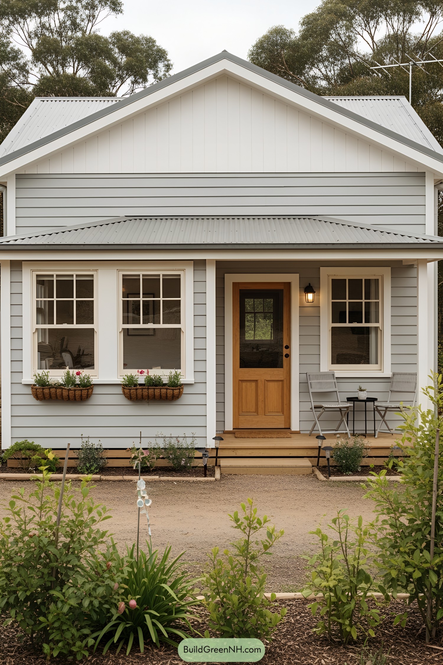 Cute, Gray Cottage with White Trim and Patio Chairs