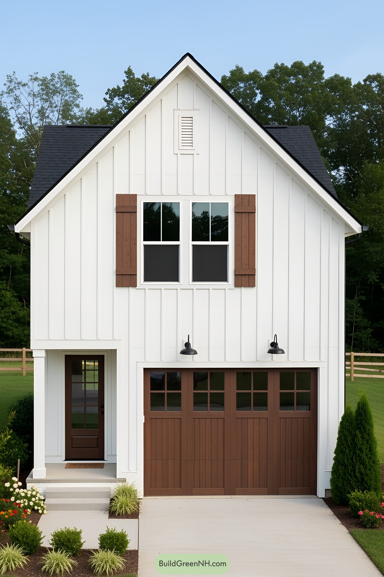 Compact white house with brown accents and a neat garden