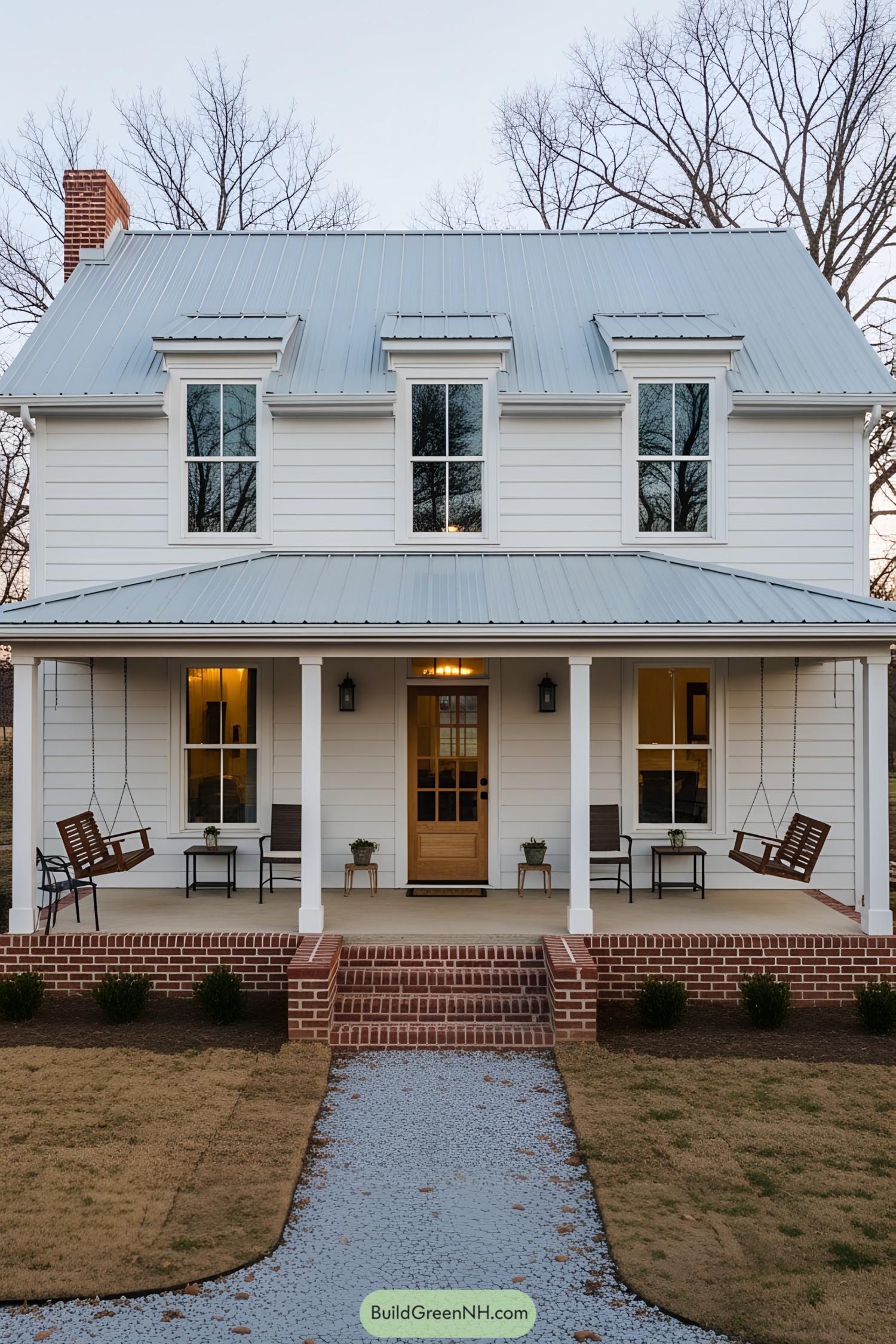 White farmhouse with porch swings and red brick steps
