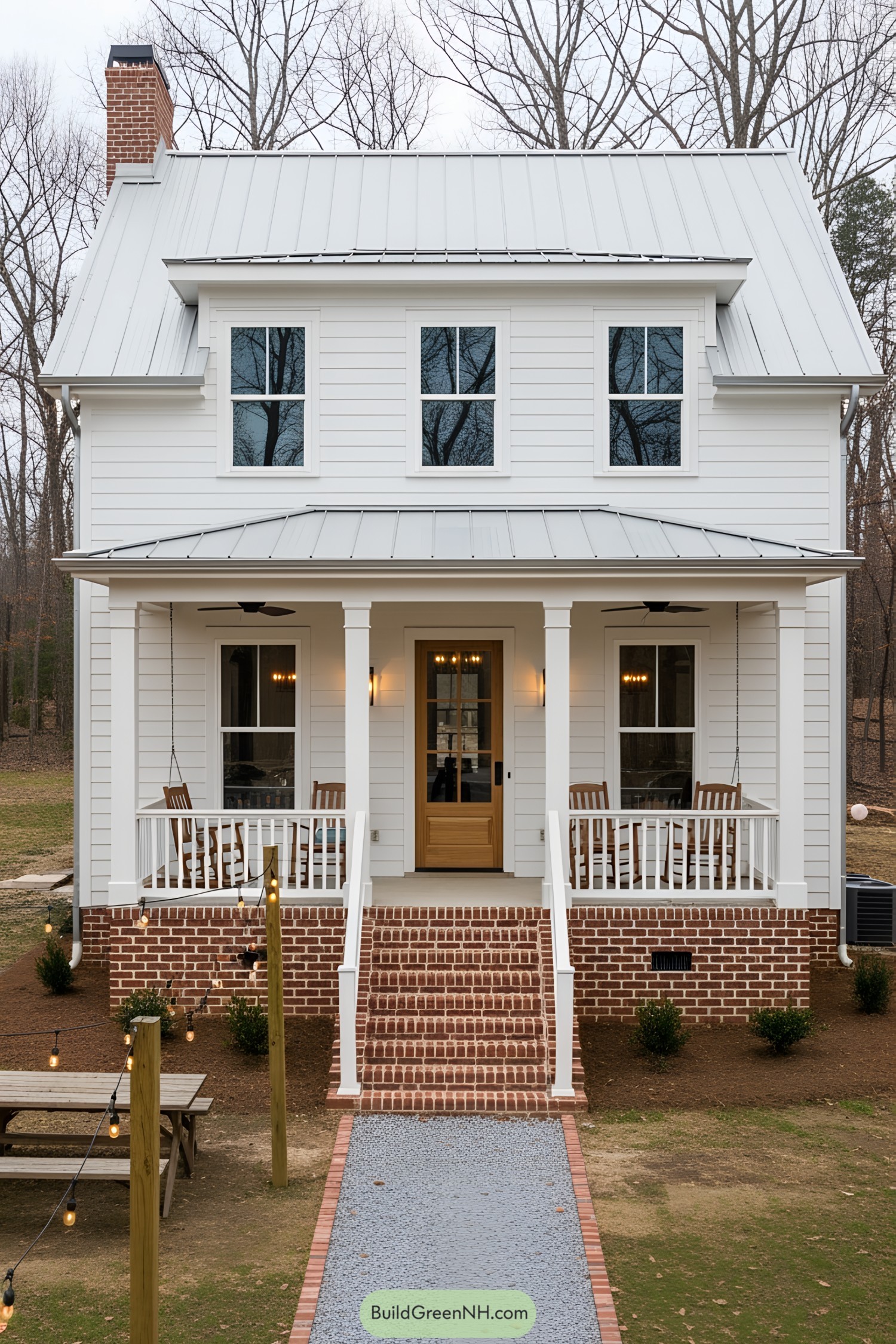 Cozy farmhouse with a charming porch and swing