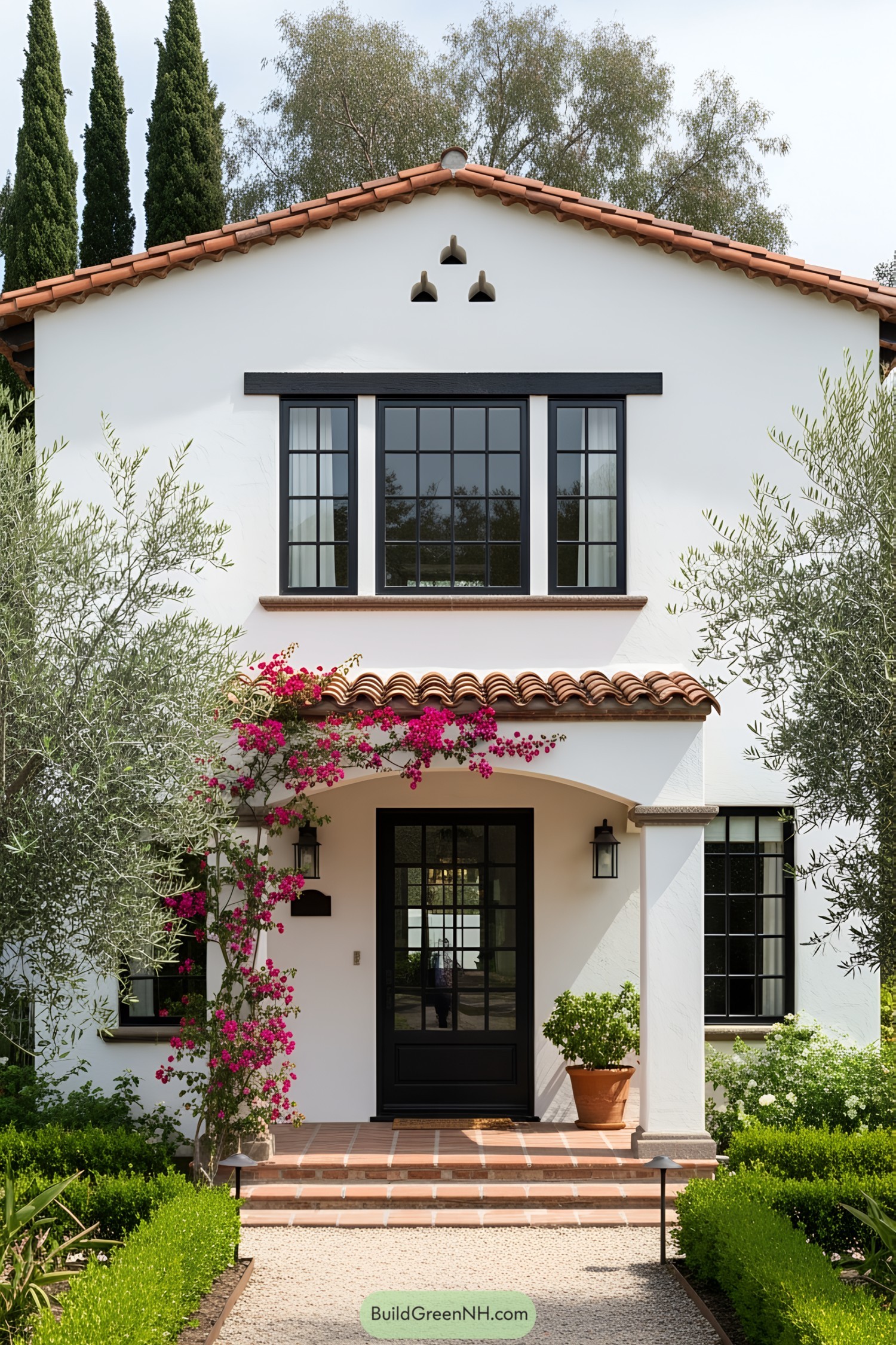 Neatly kept garden and traditional Mexican house with floral accents
