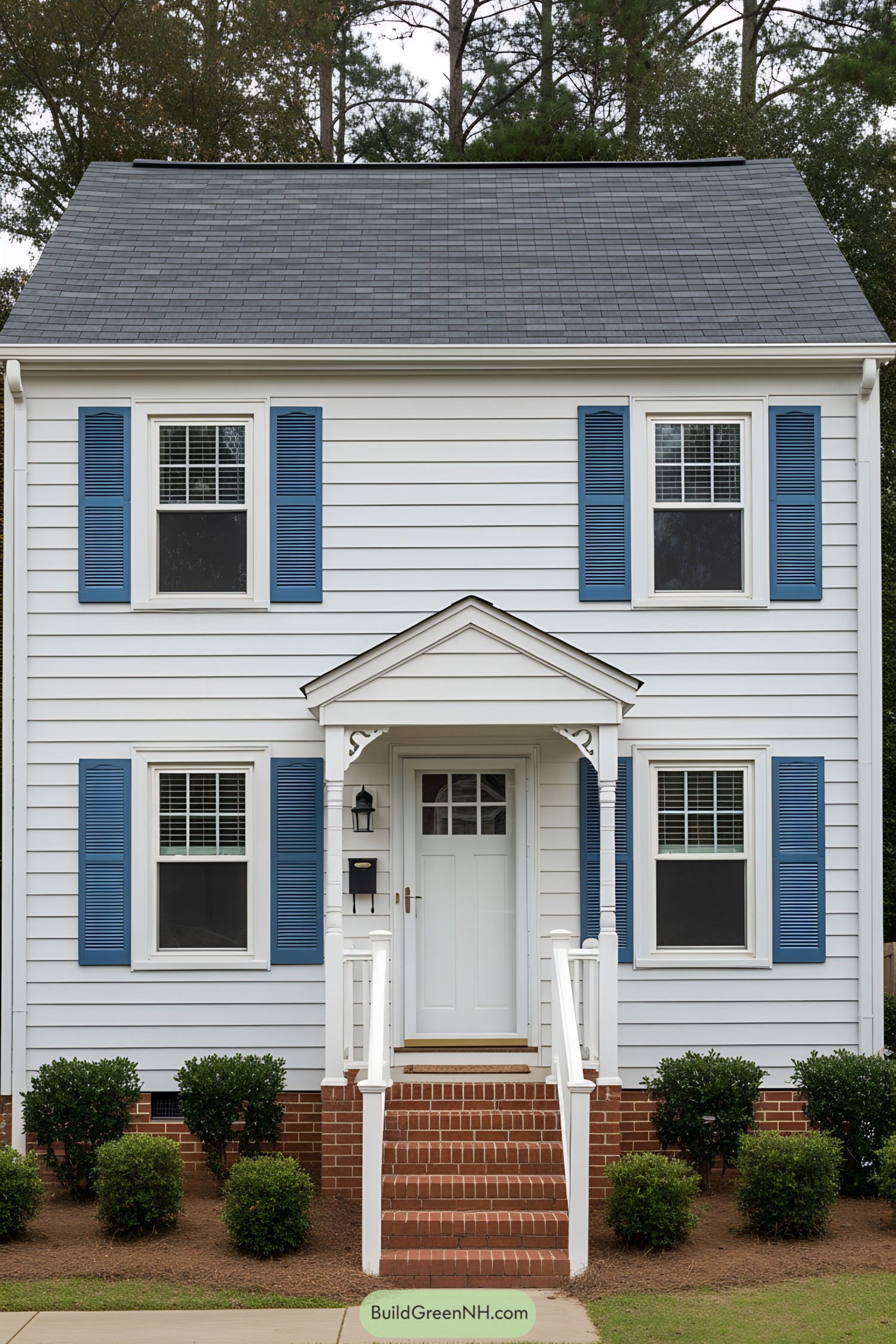 Small white house with blue shutters and red brick steps