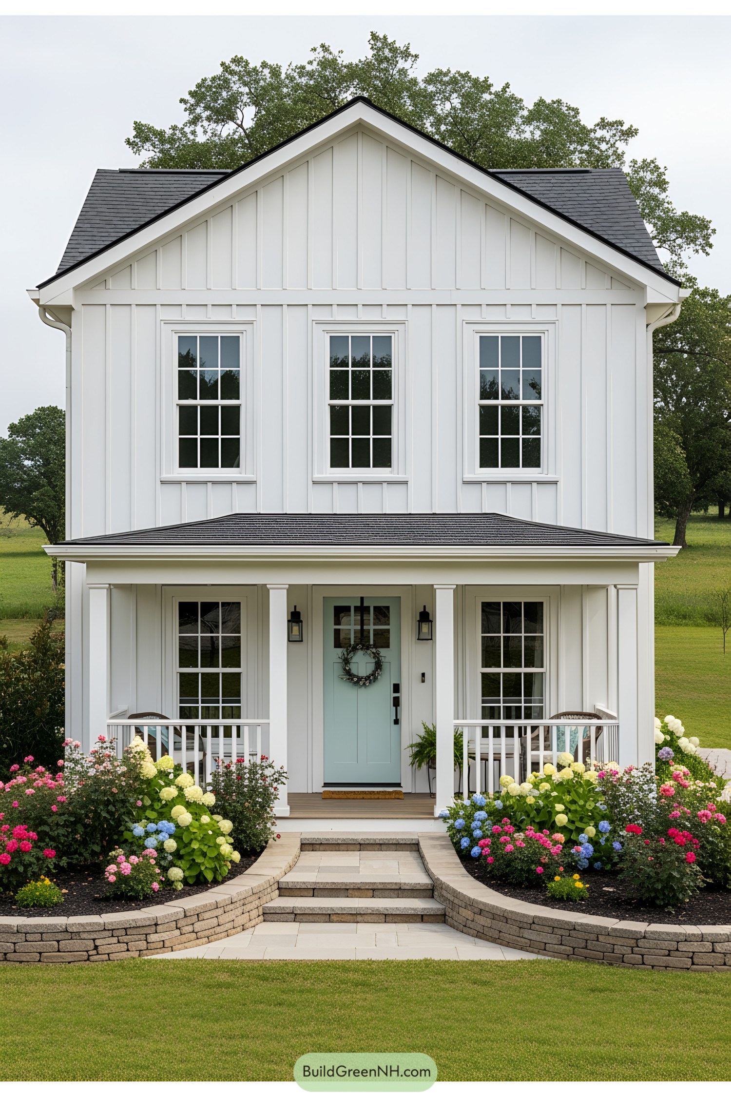Small white house with vibrant garden