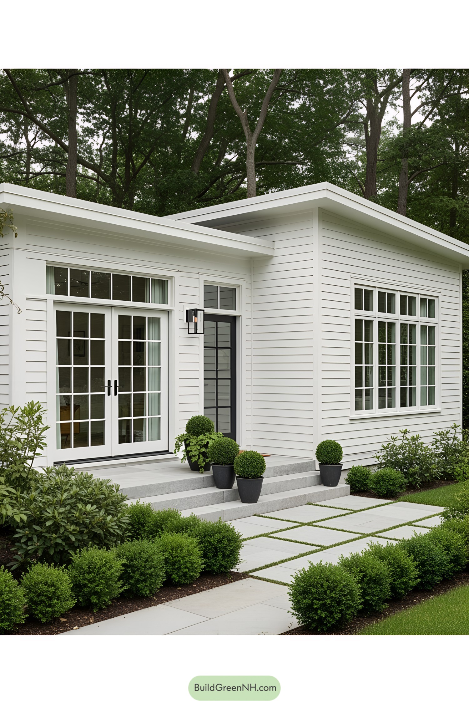 Charming white house with lush landscaping