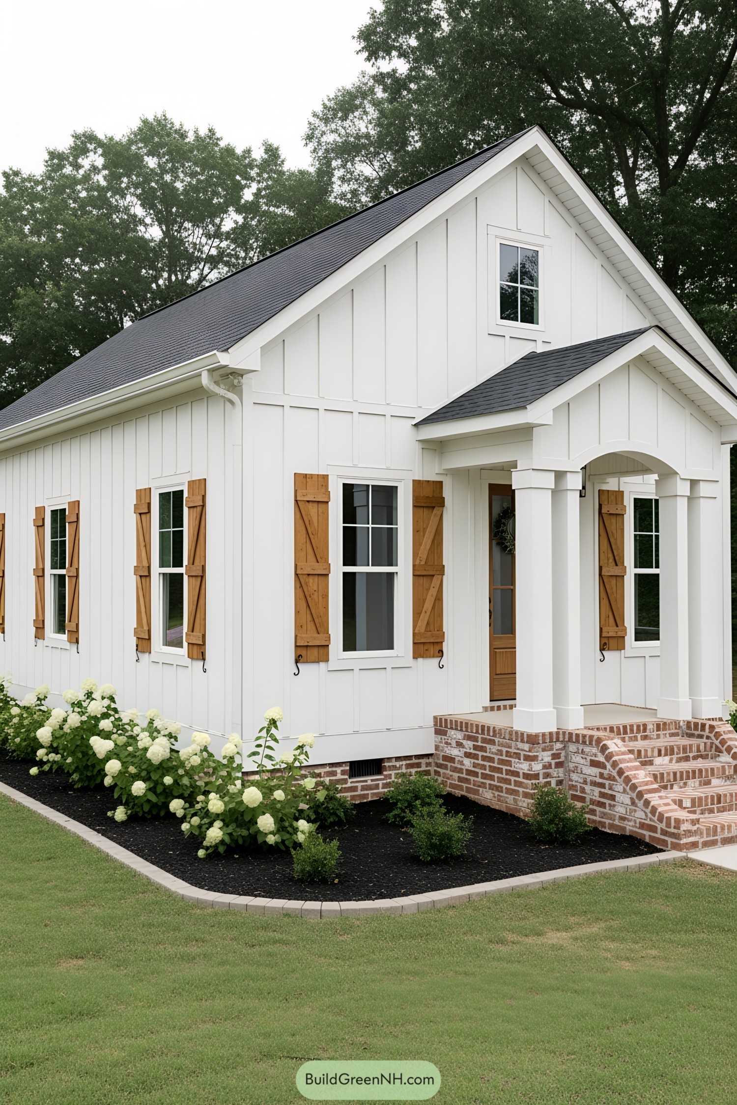White house with wooden shutters and a small porch