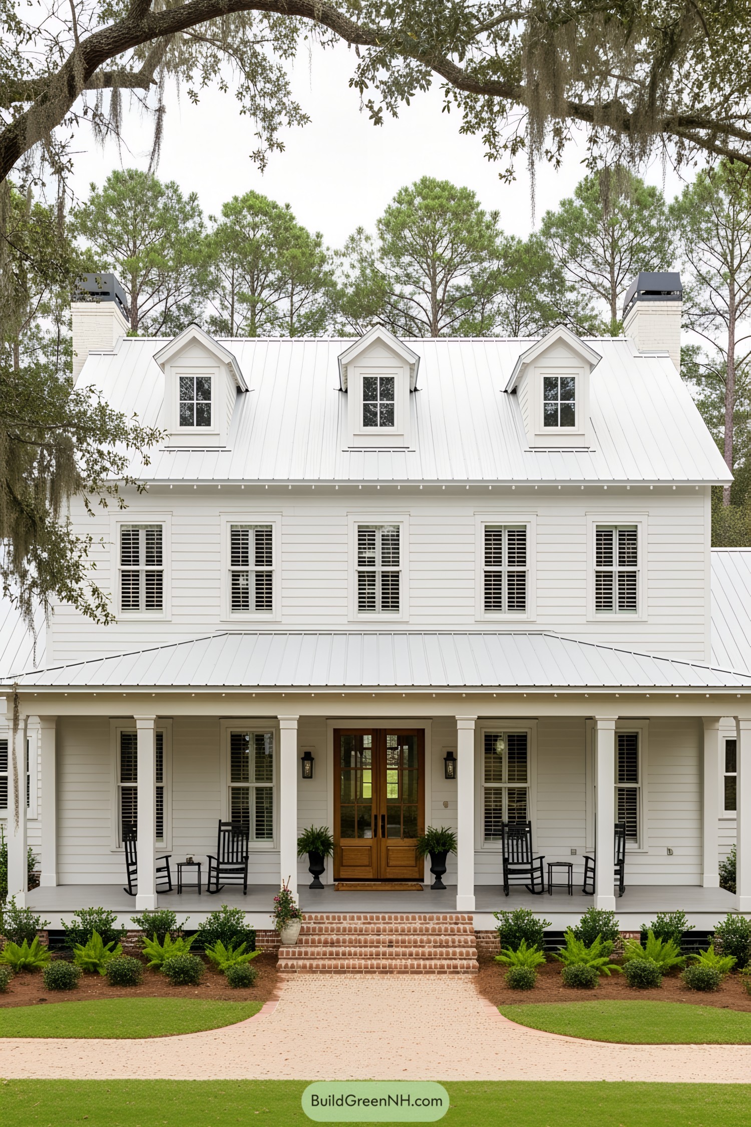 A classic white southern farmhouse with a welcoming front porch