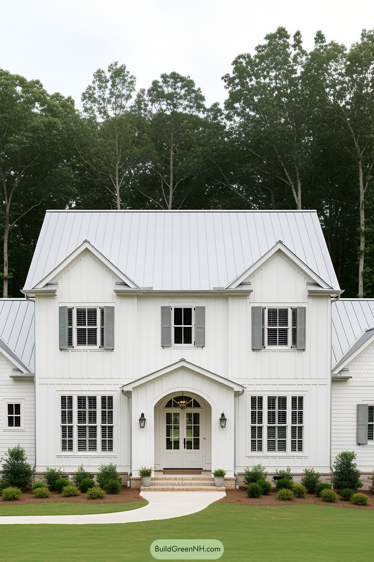 Charming white farmhouse with a gable roof and symmetric windows