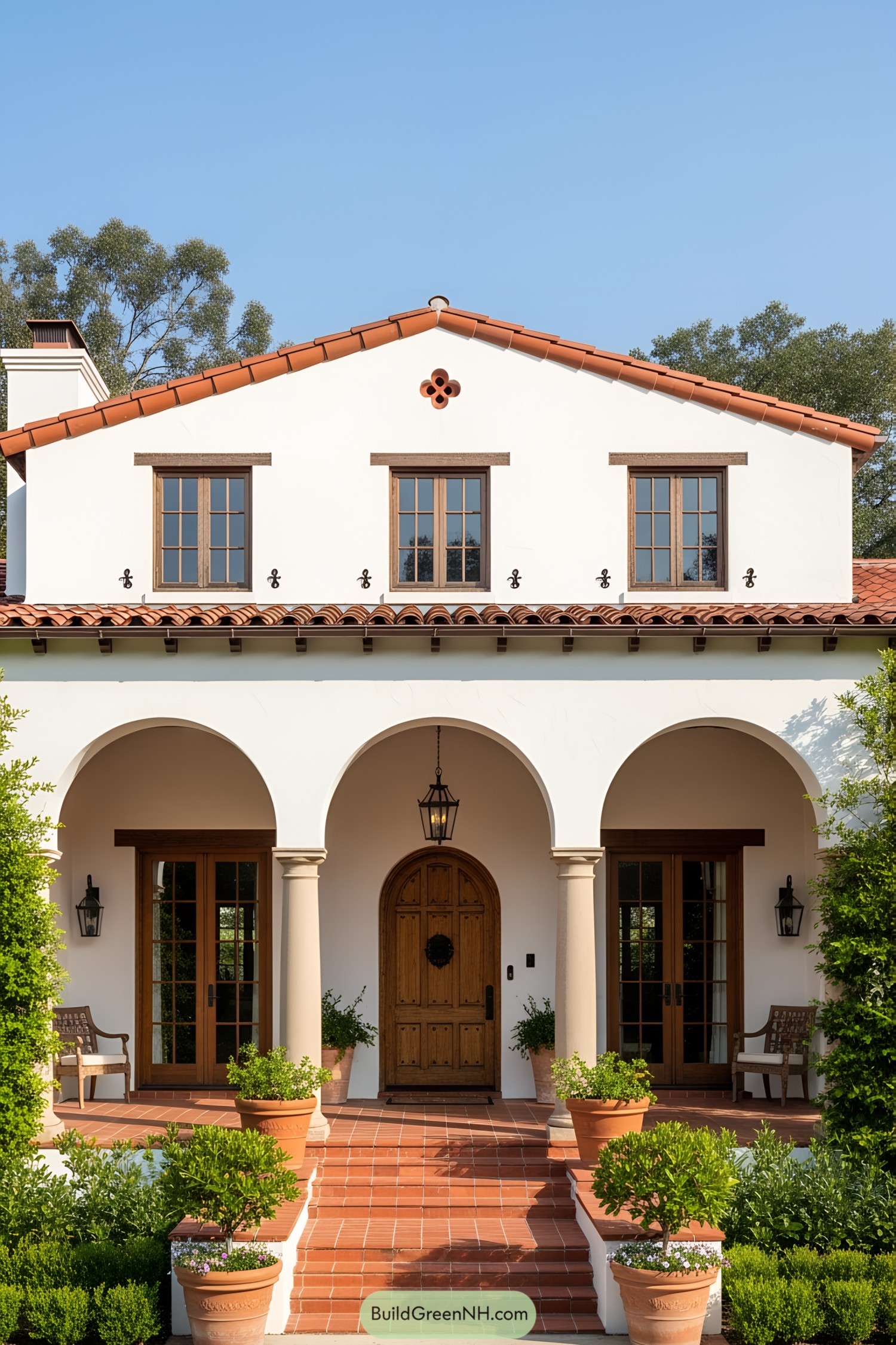 Spanish-style ranch house with terracotta roof and arches