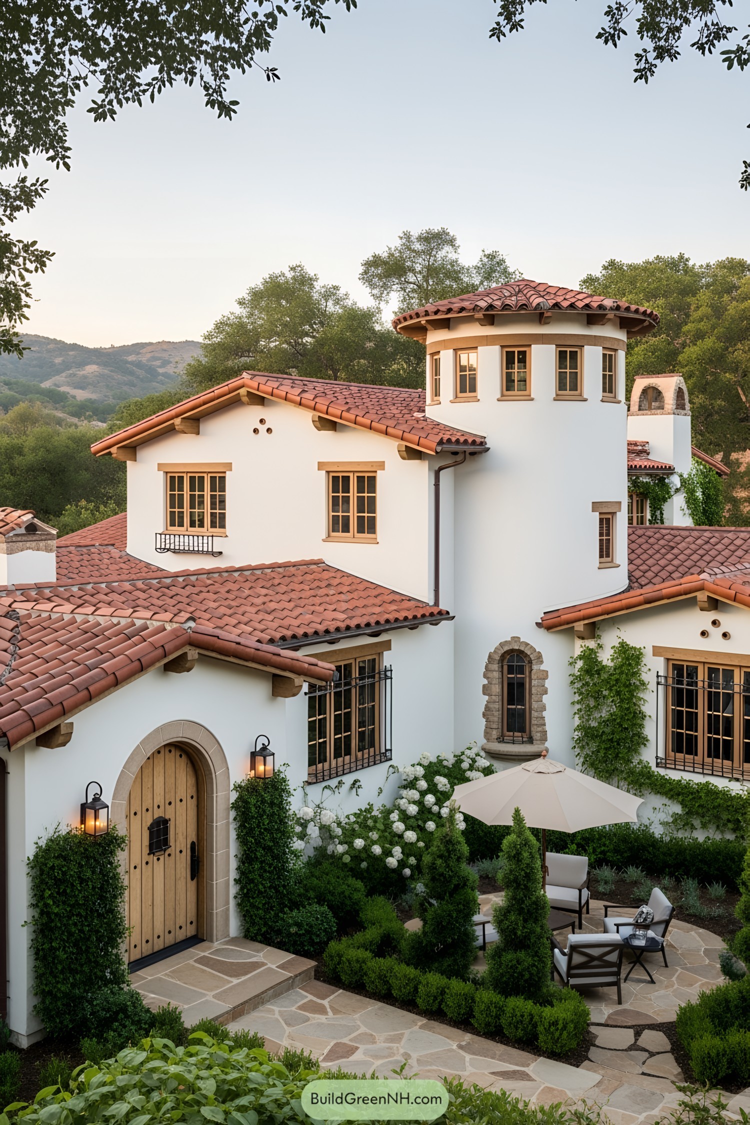 Spanish-style house with red tile roof and stone path