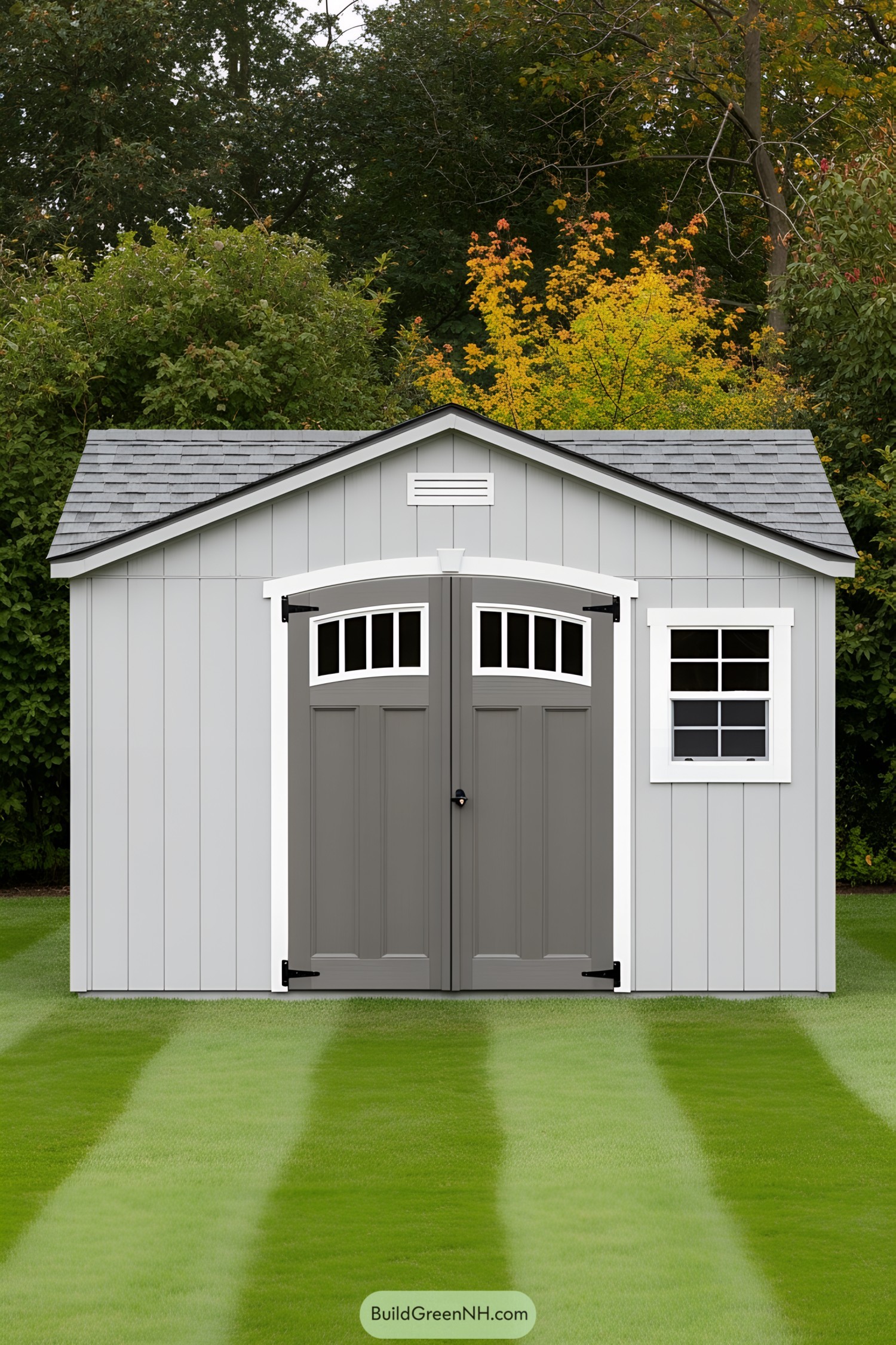 Gray shed with double doors and a window