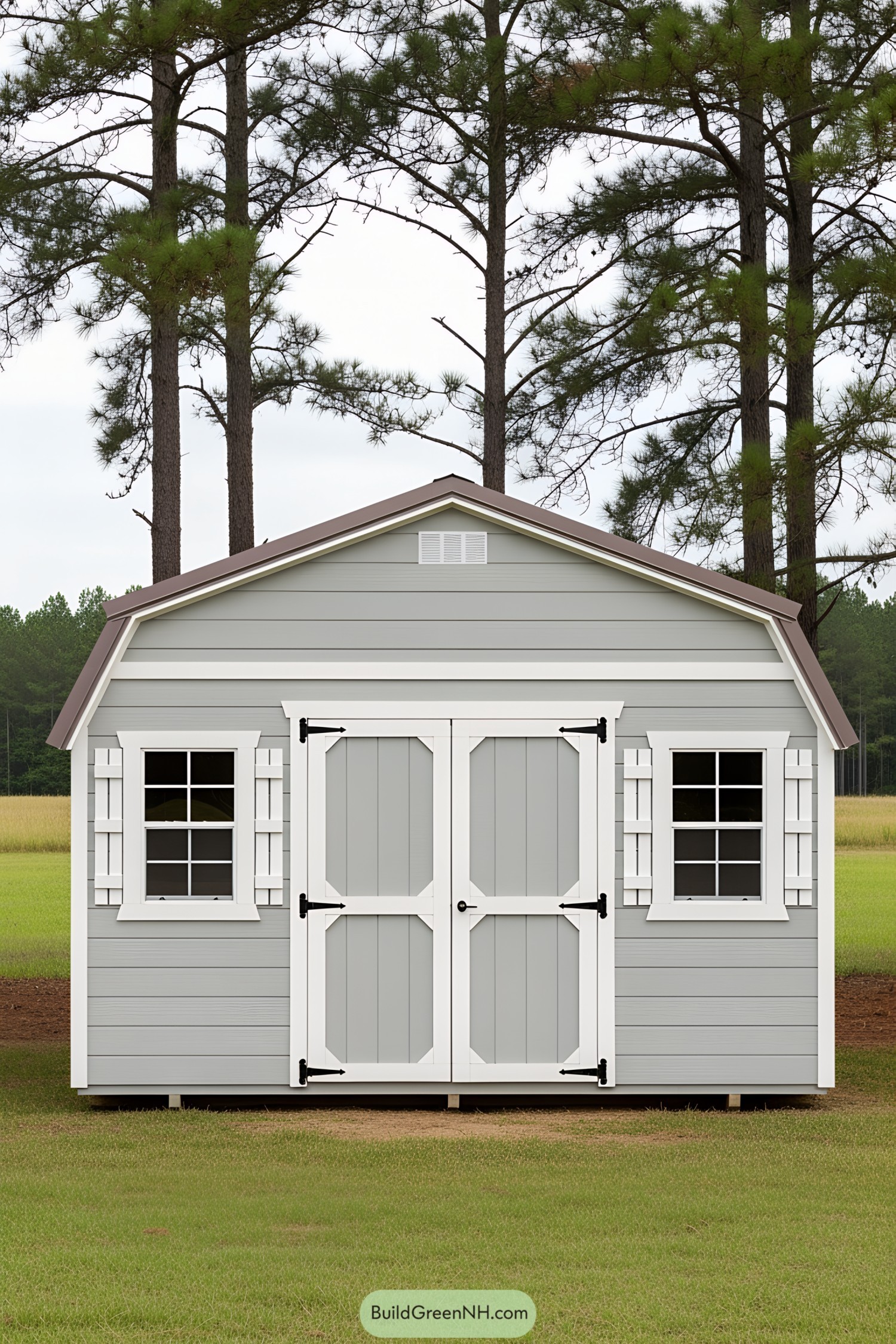 Quaint grey storage shed with white trim in a wooded area